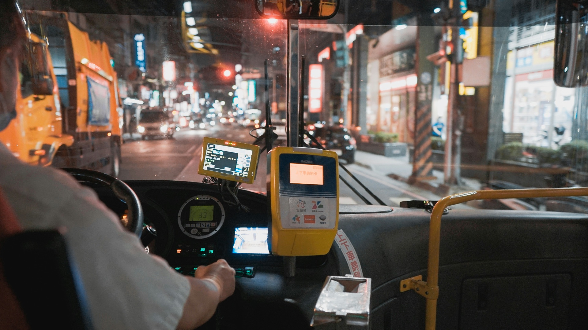 person holding black and yellow digital device