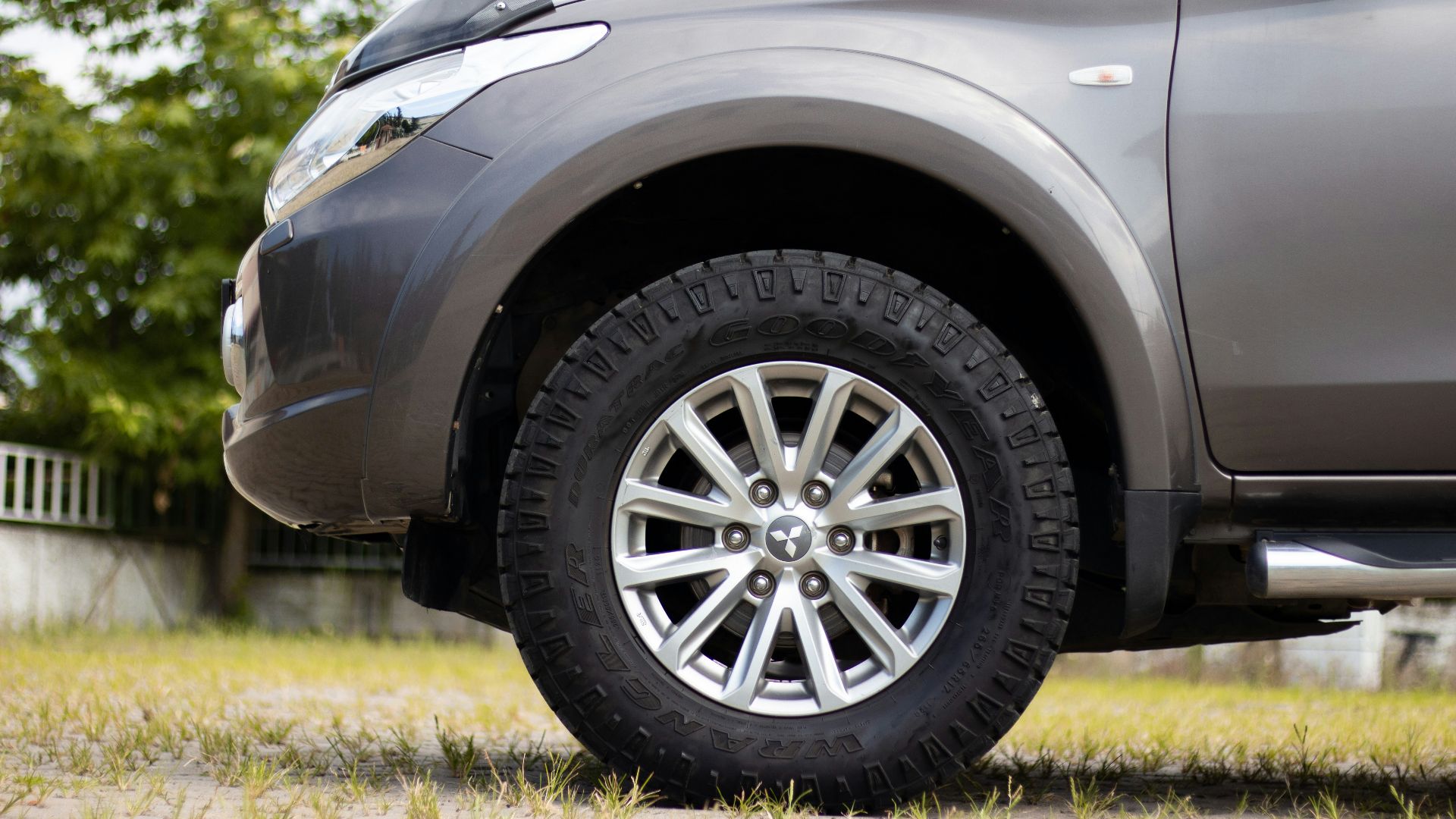 gray car with gray wheel