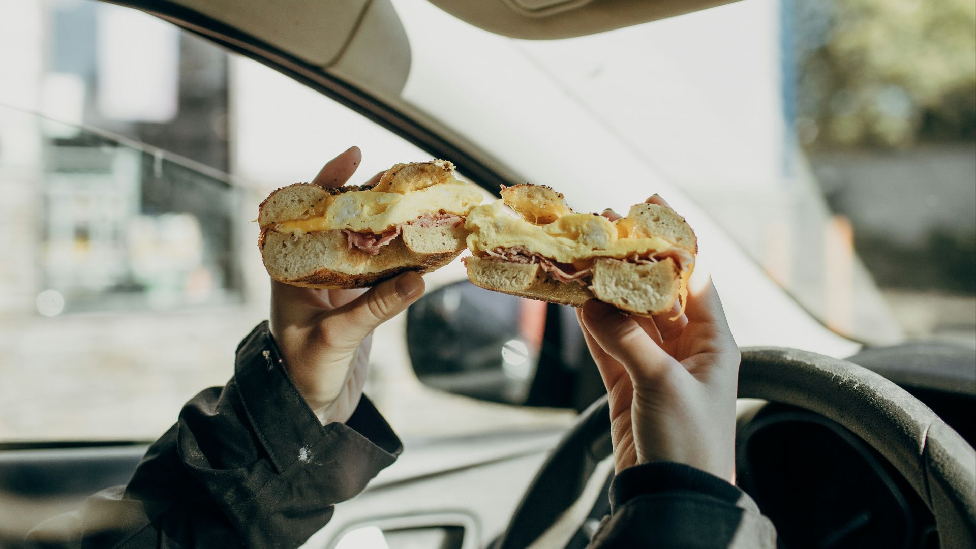 person holding bread with meat