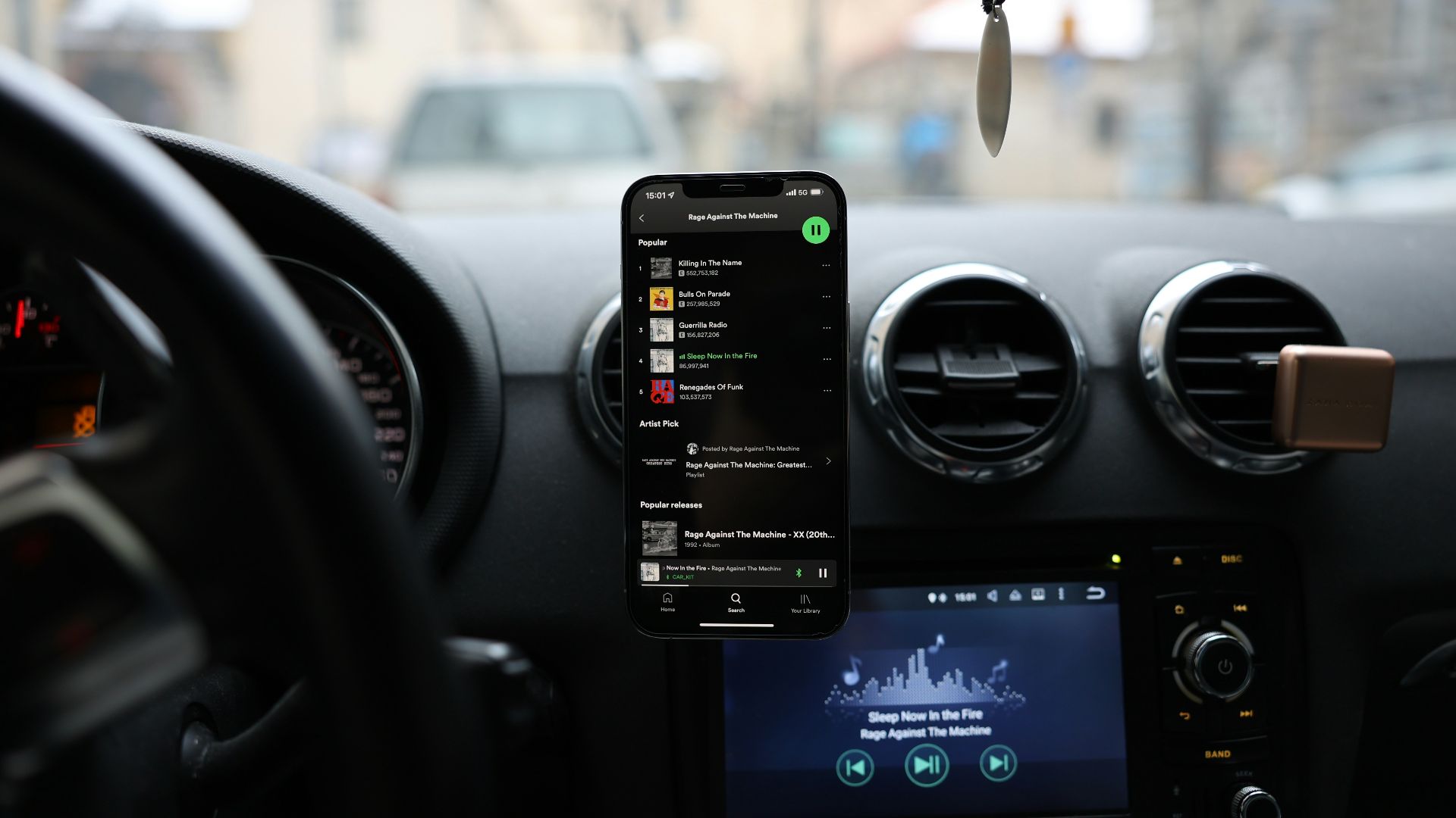 a car dashboard with a cell phone and gps