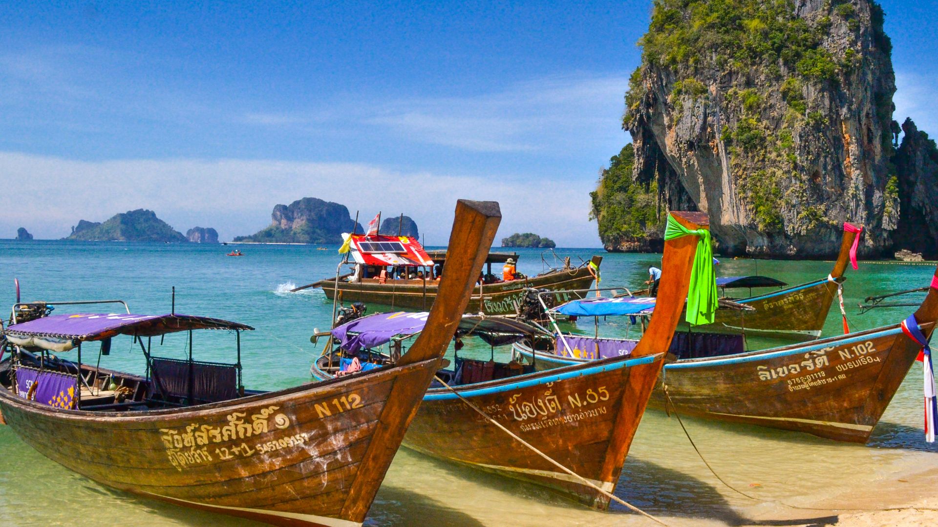 five brown wooden boats