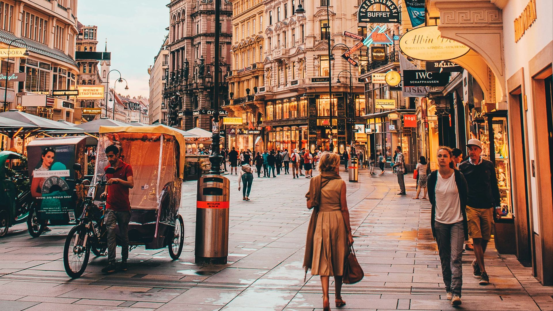 people walking beside Berlitz building during daytime