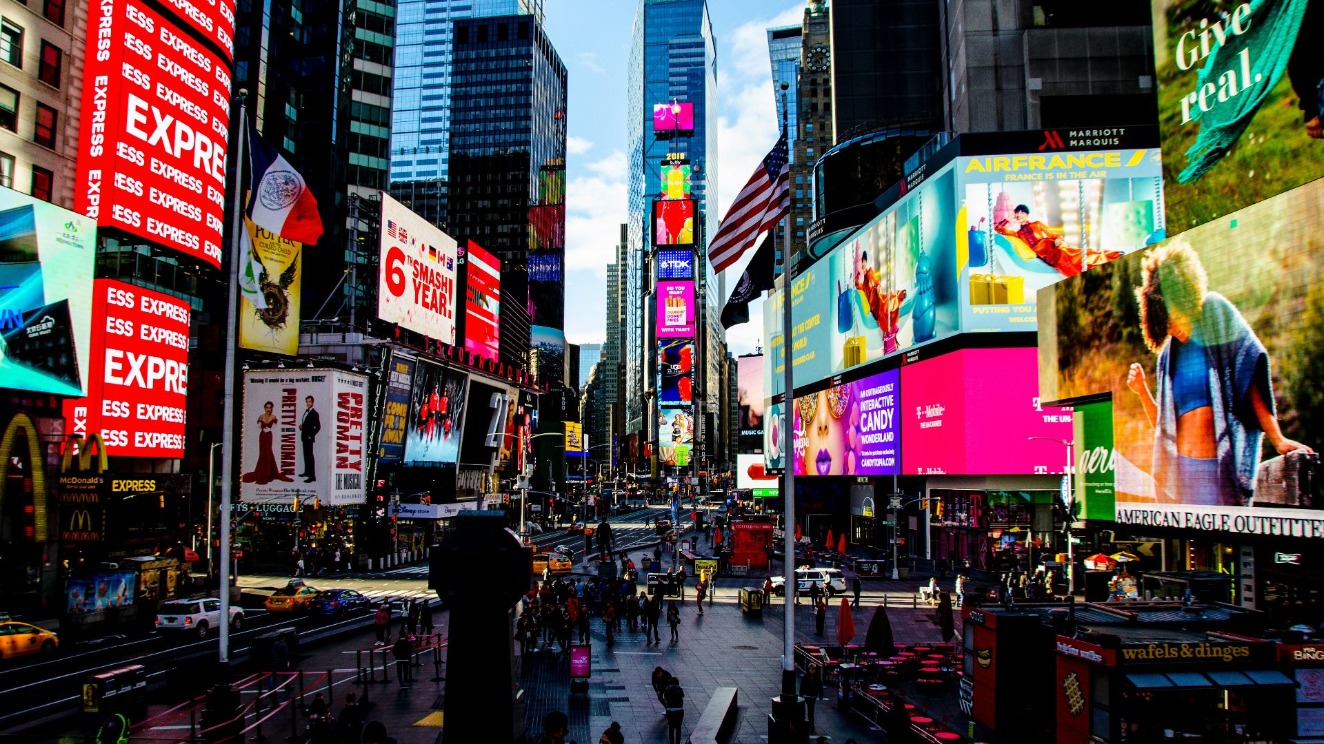 group of people walking near high-rise buildings
