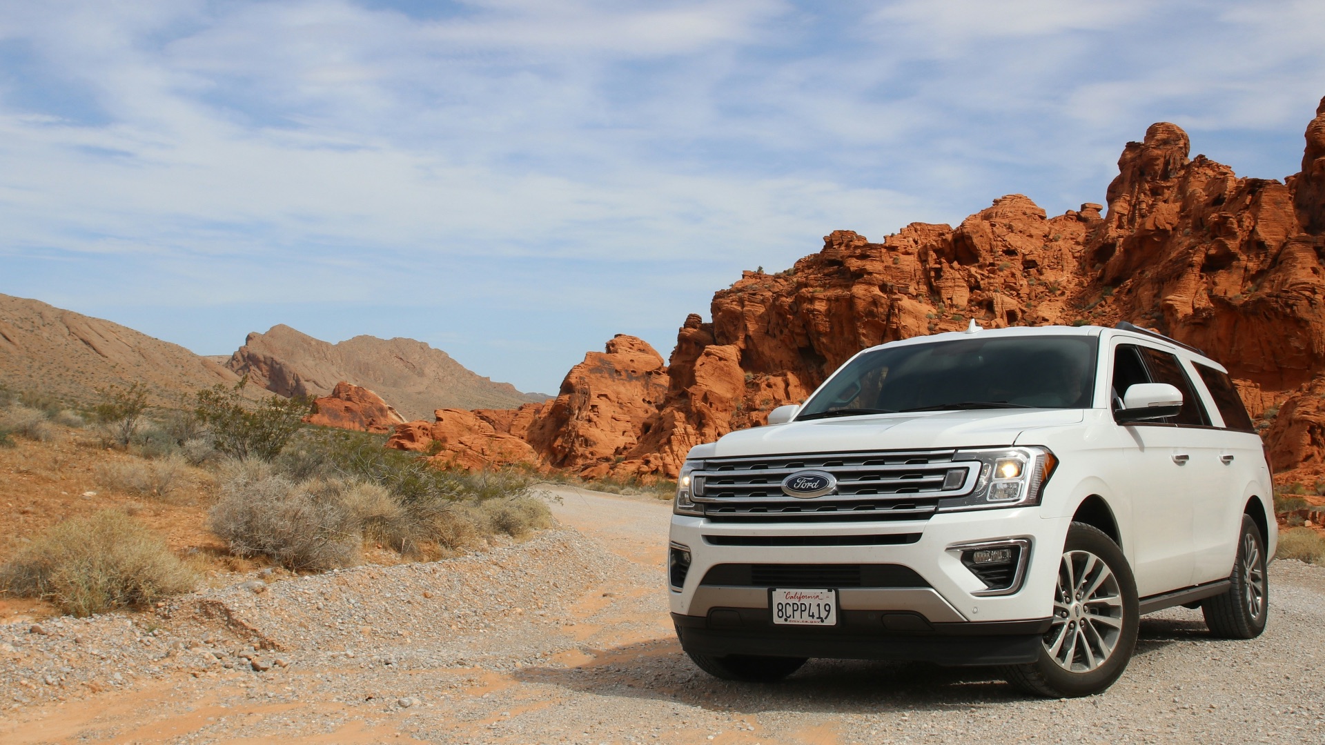 parked white Ford Explorer SUV