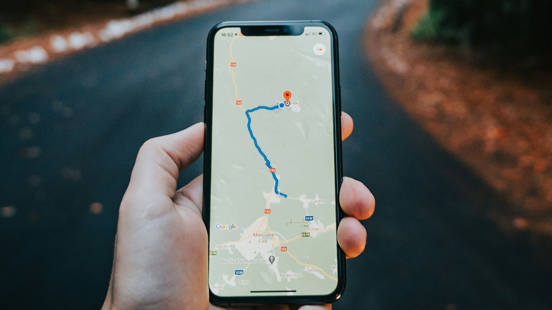 person holding white iphone 5 c