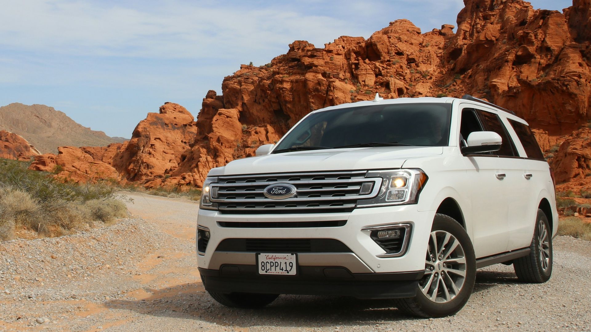 parked white Ford Explorer SUV