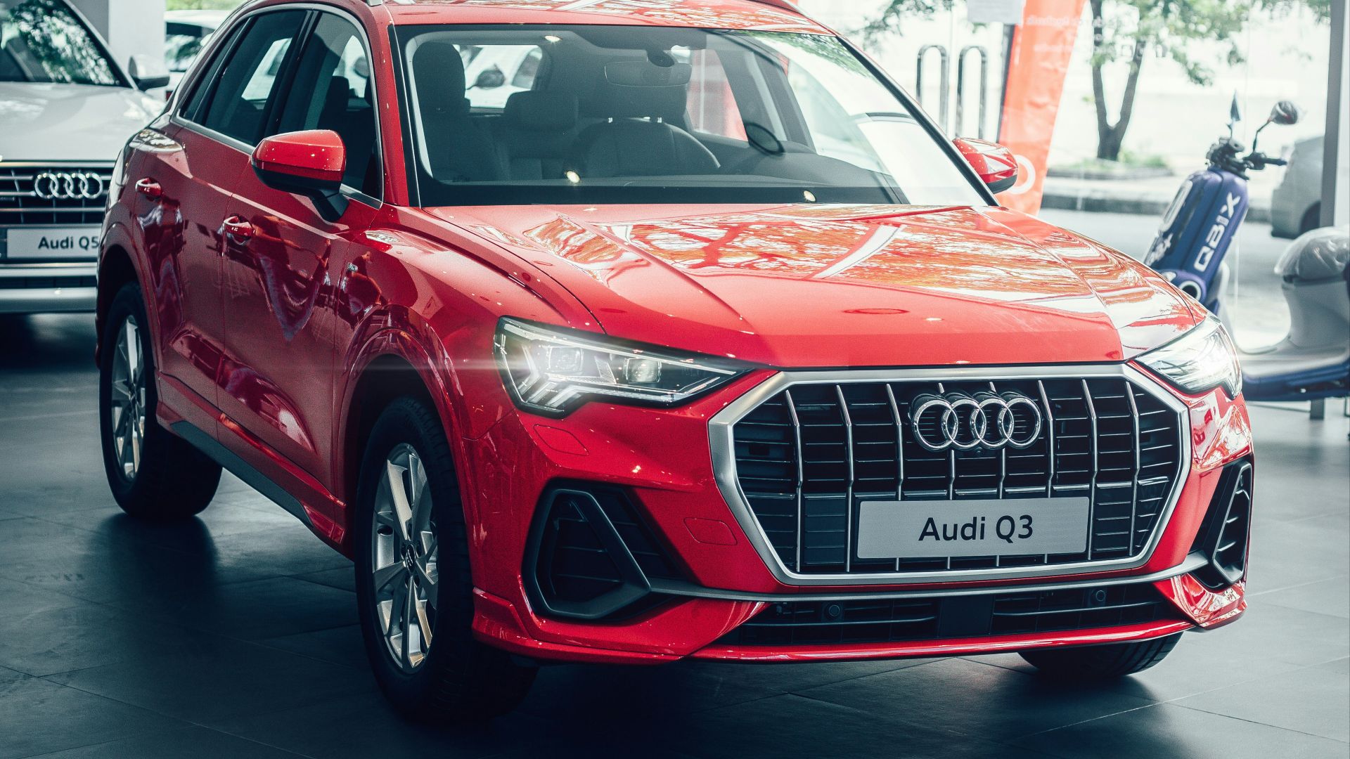 red audi a 4 parked in a room