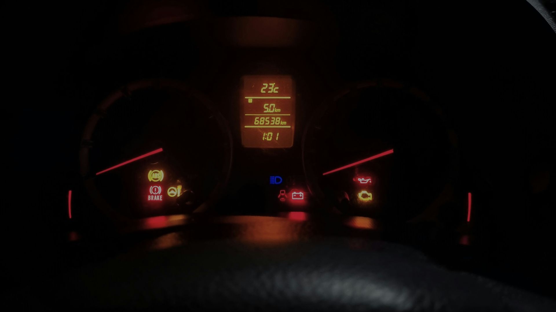The dashboard of a car at night time