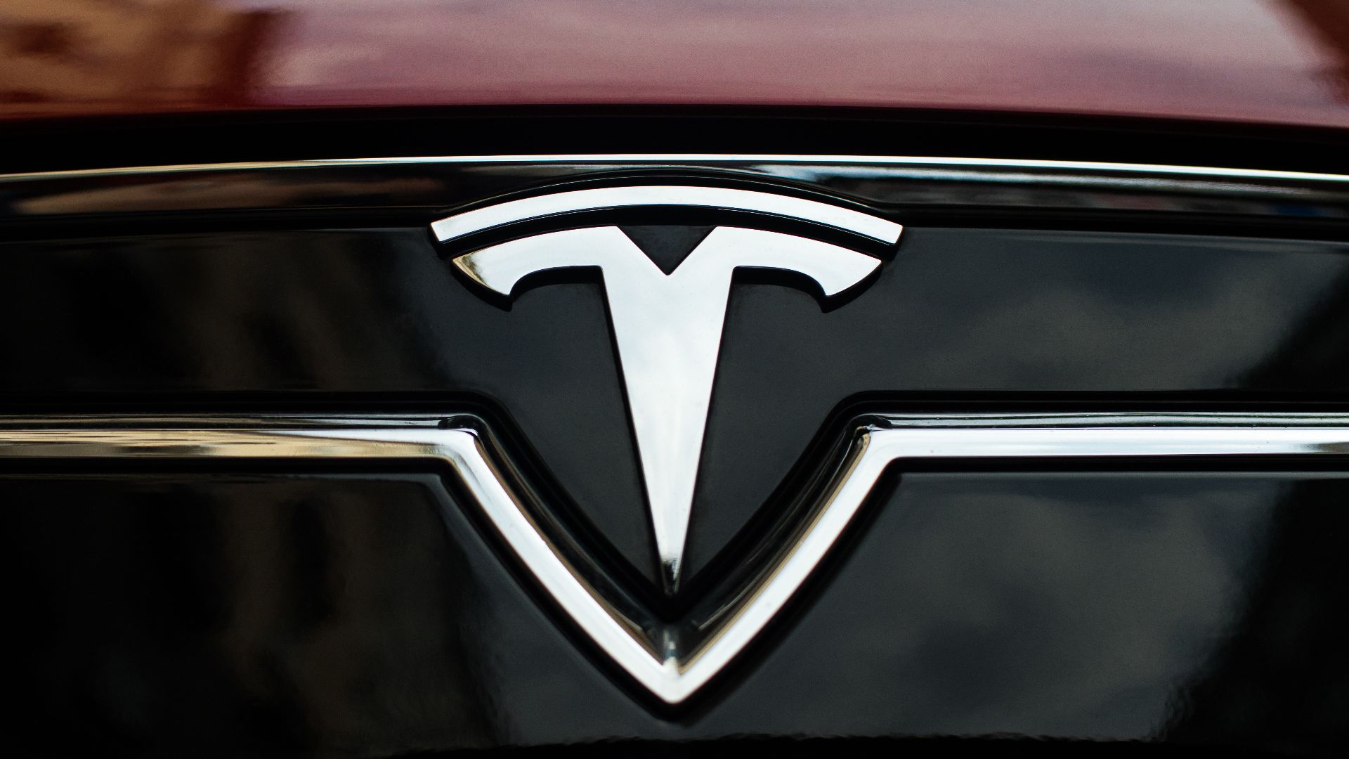 File:TESLA badge on a car.jpg