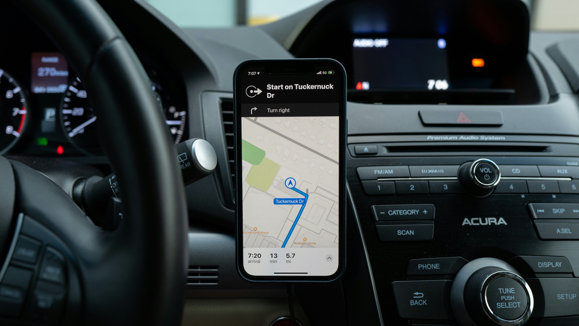 black android smartphone on car center console