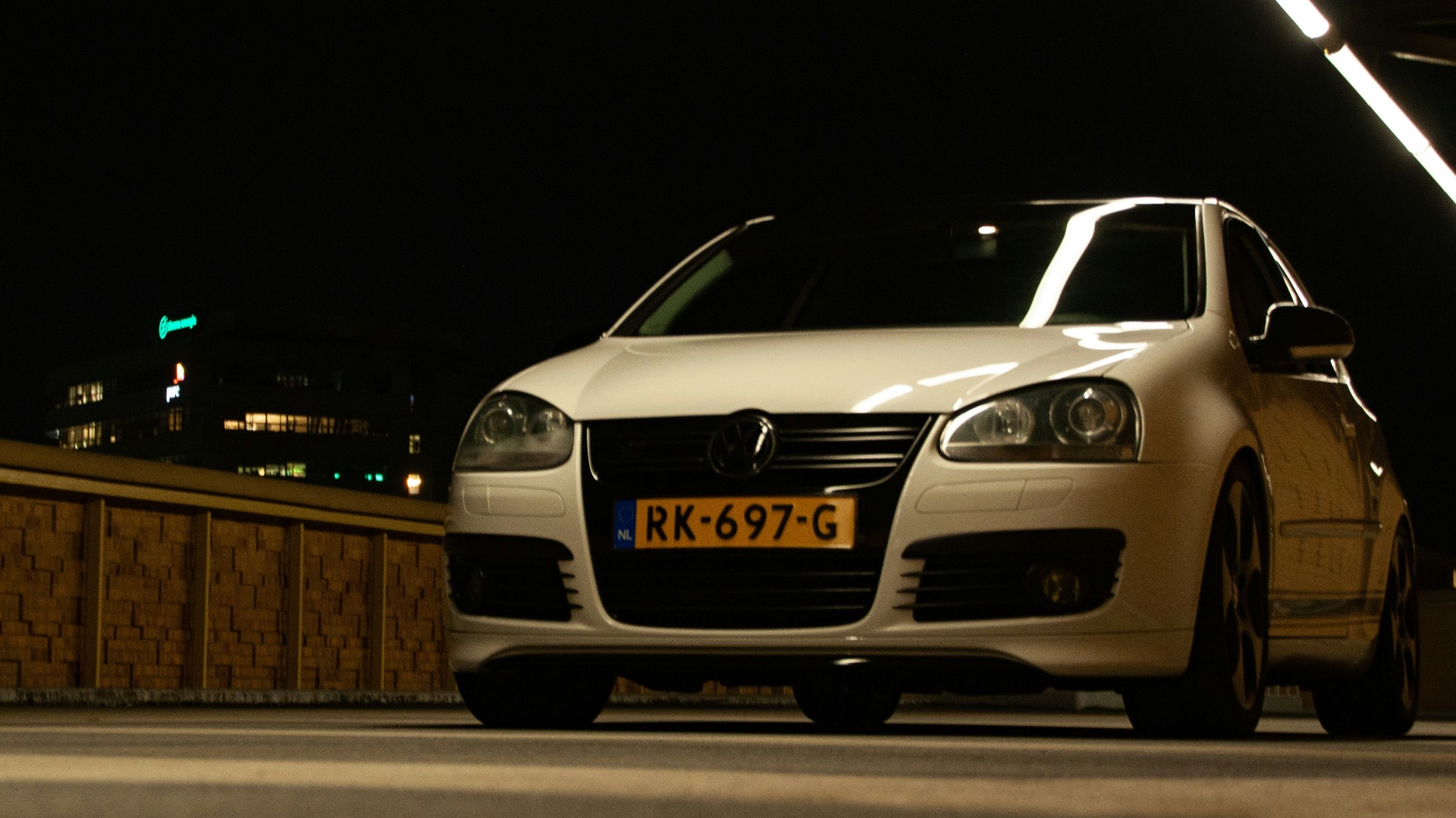 a white car parked on the side of the road