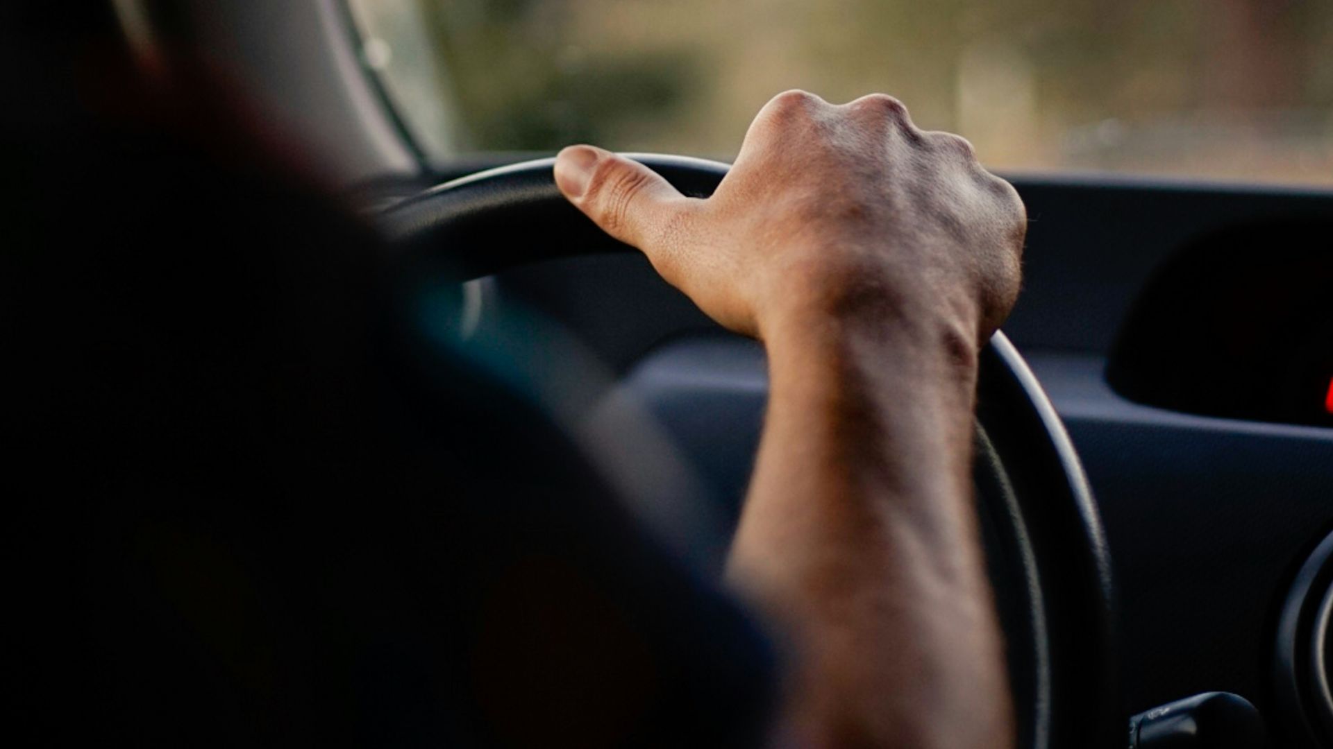 person driving car during daytime