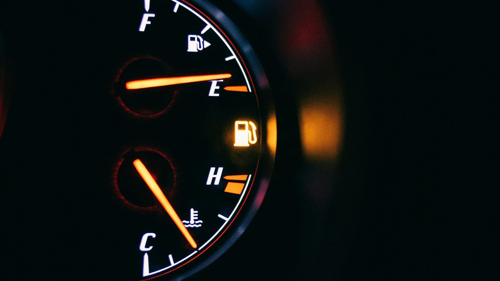 black and red analog speedometer