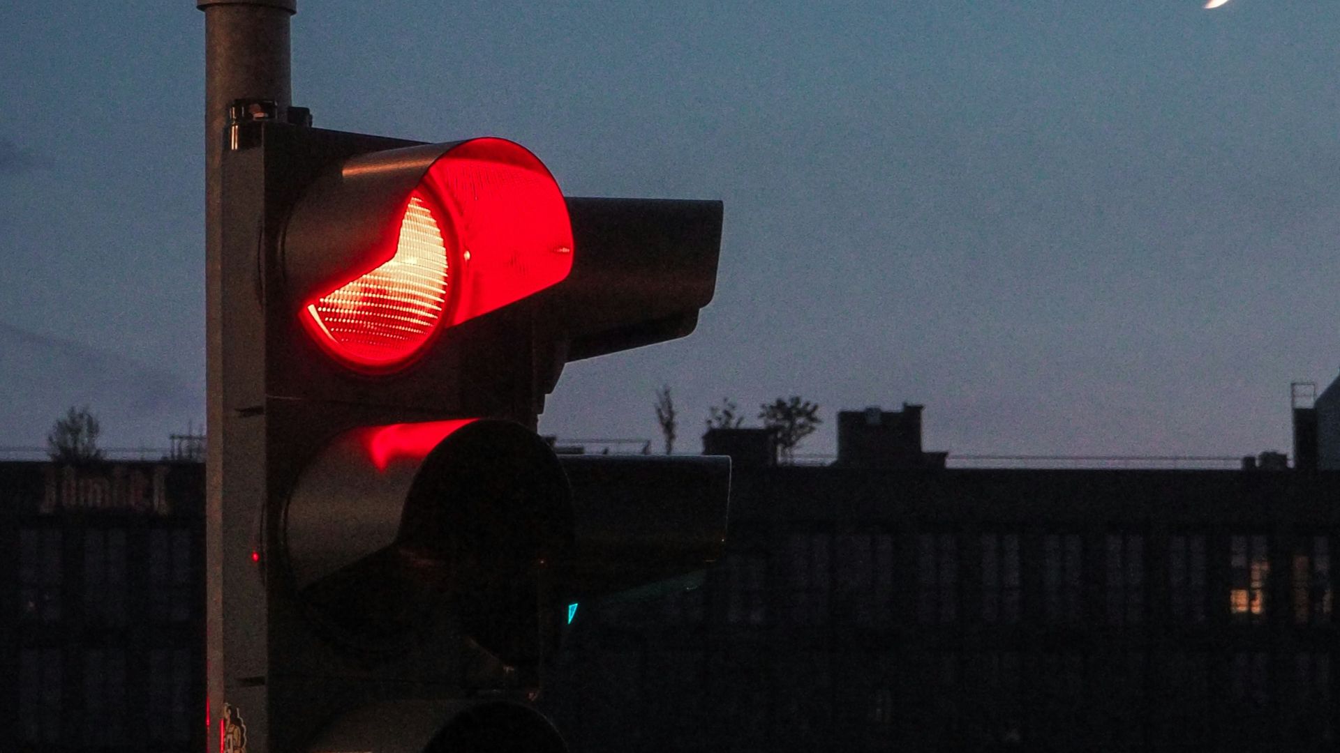 a traffic light sitting on the side of a road