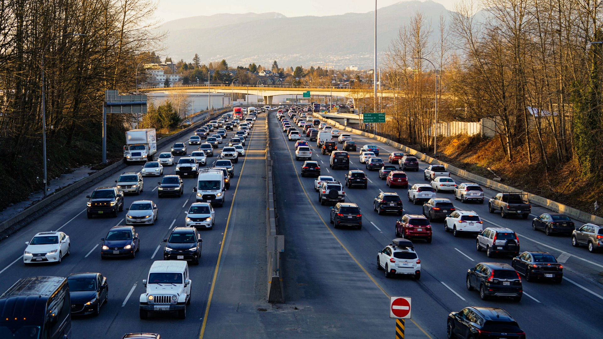 Highway is experiencing heavy traffic with many cars.