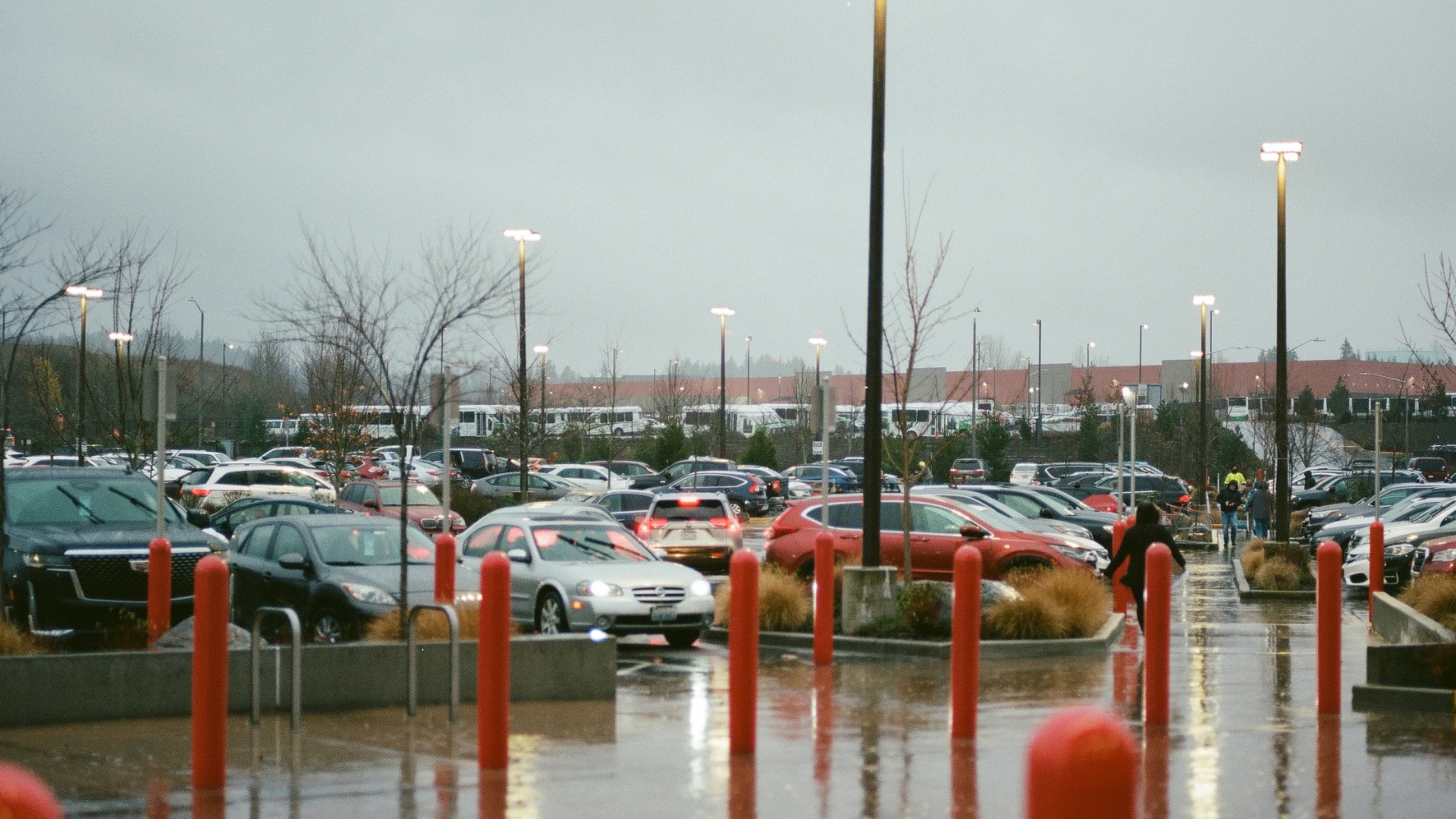a parking lot filled with lots of parked cars