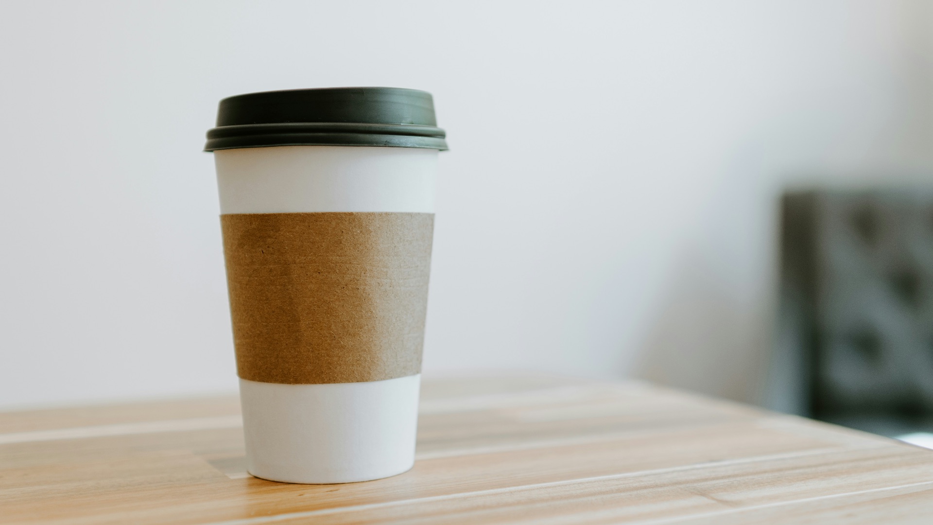 white and brown paper cup