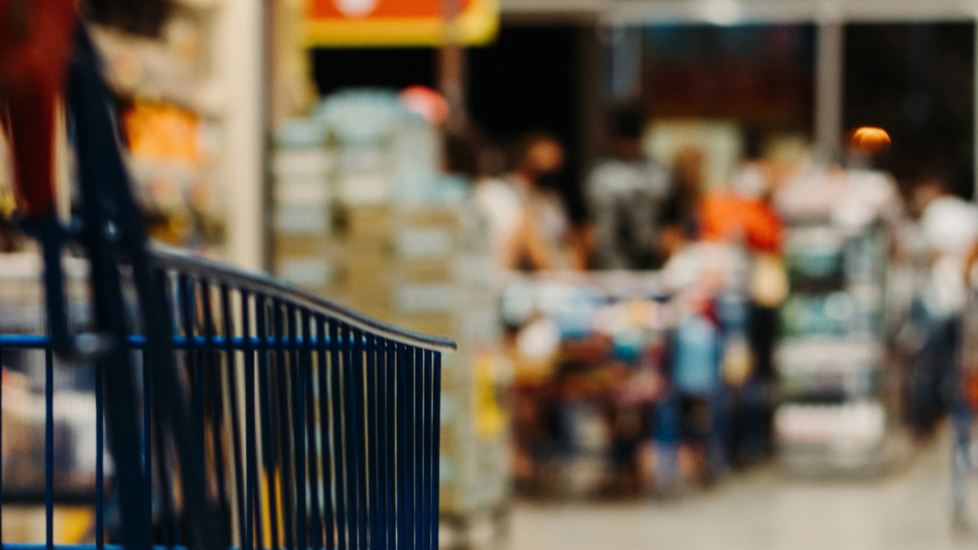 blue shopping cart on street during daytime