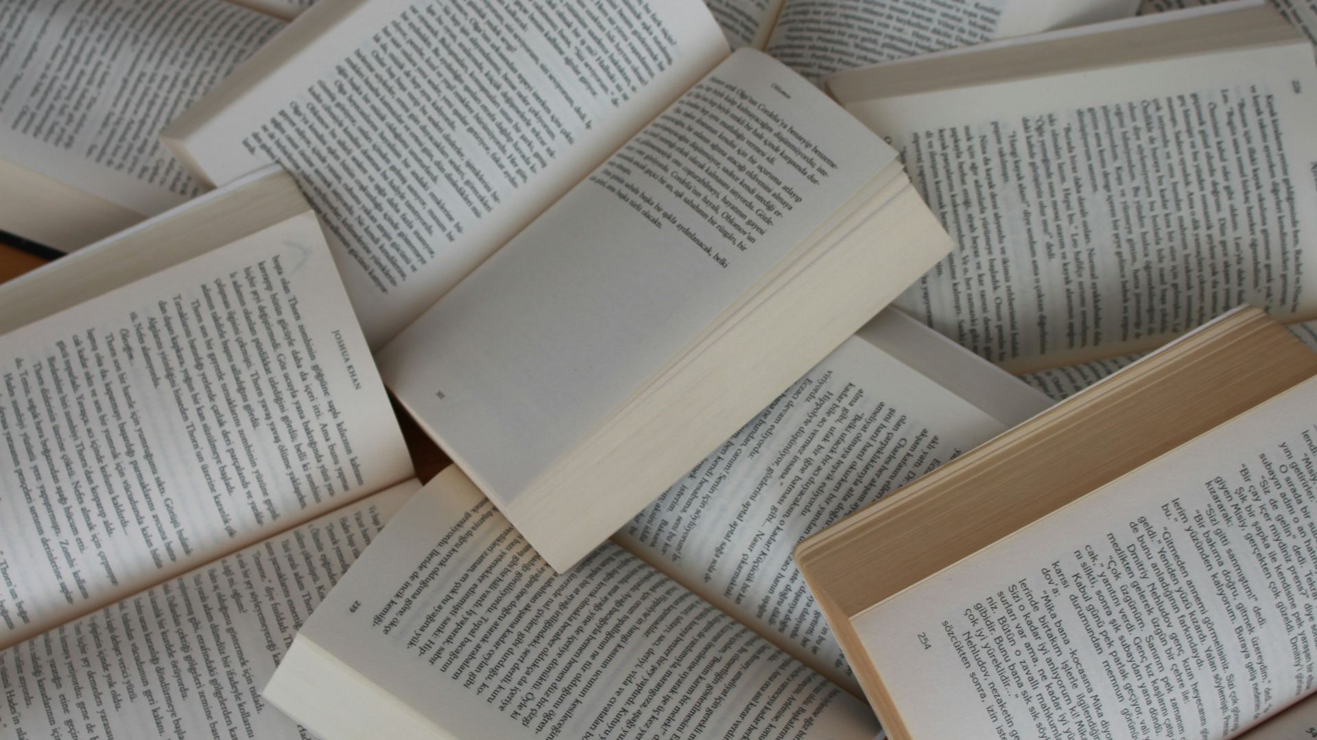white and brown book on brown woven surface