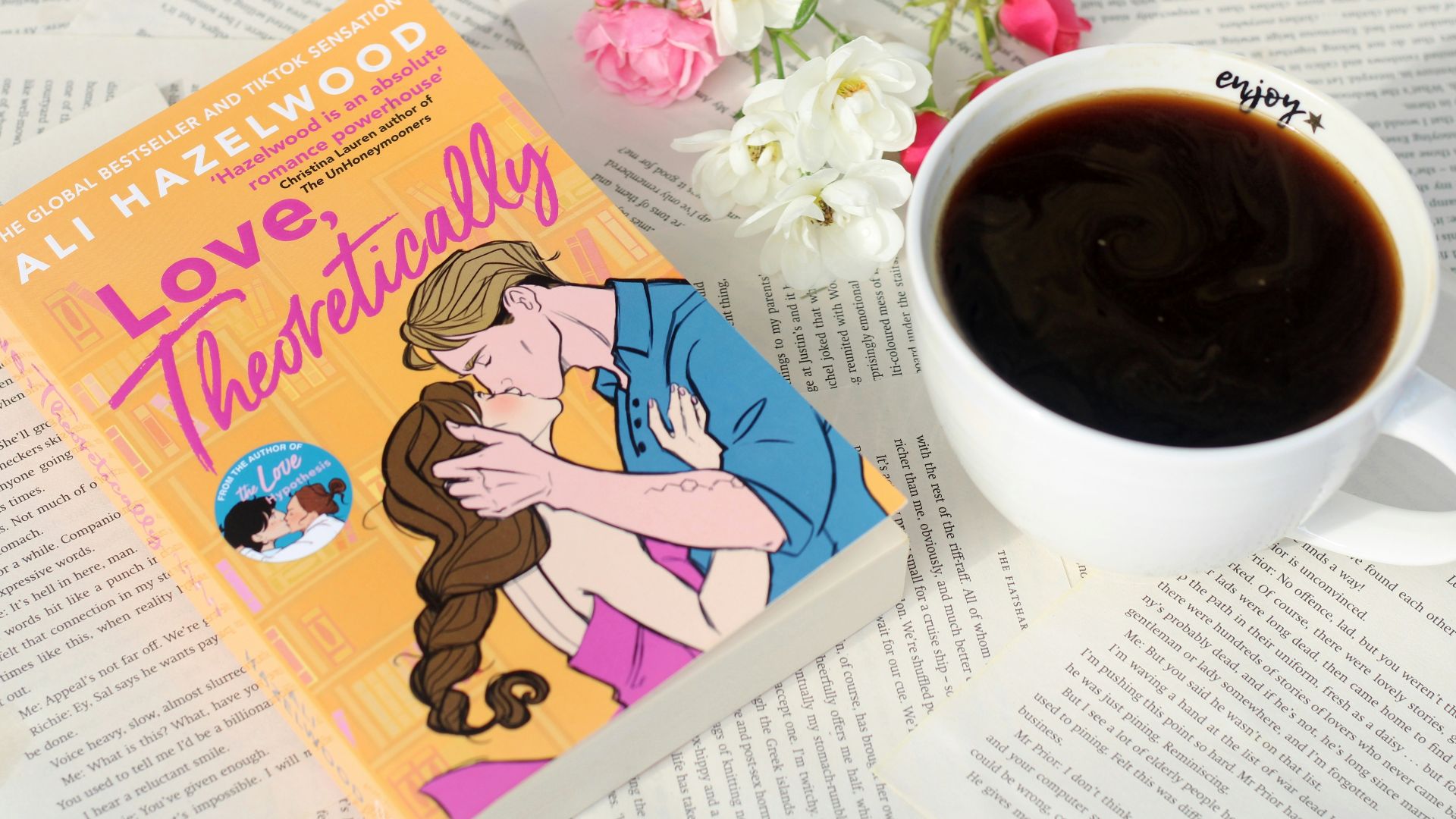 a cup of coffee and a book on a table