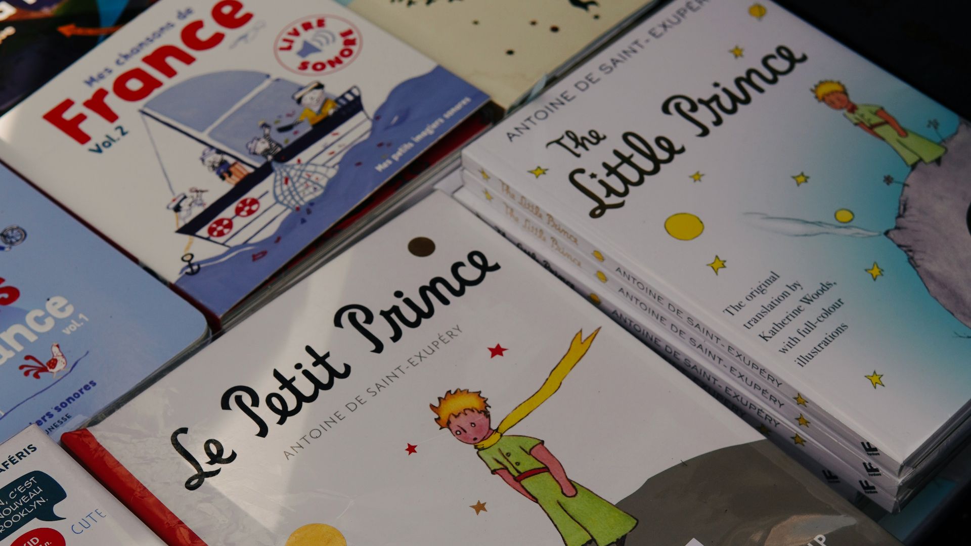 a pile of children's books sitting on top of a table