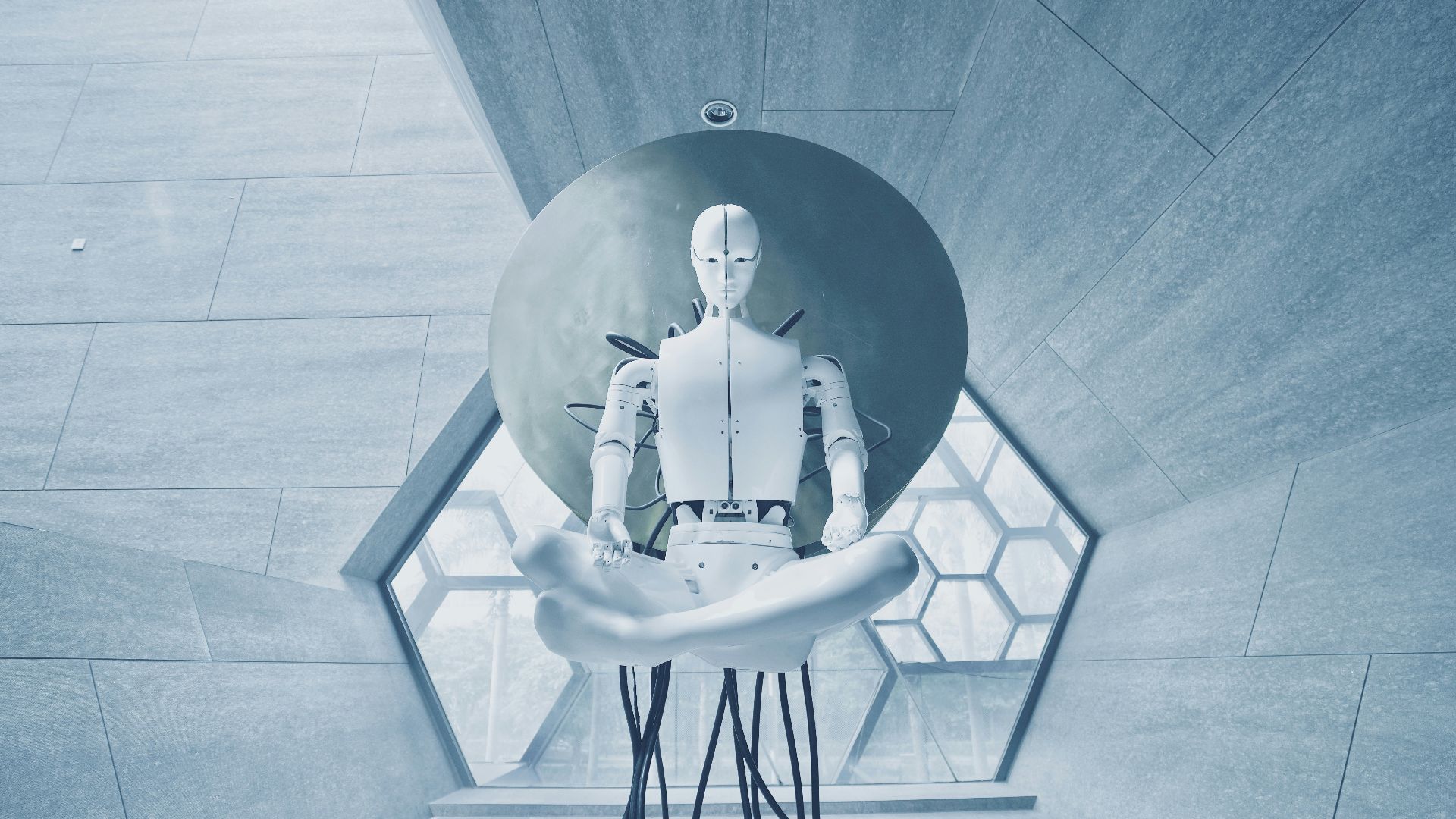 man in black jacket sitting on white chair