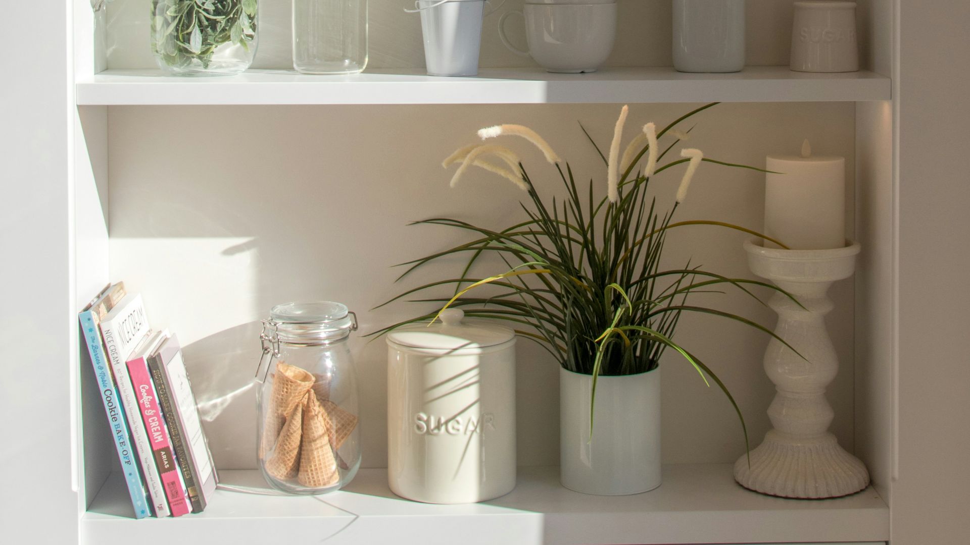 bowls and bottles in white wooden 4-layer shelf
