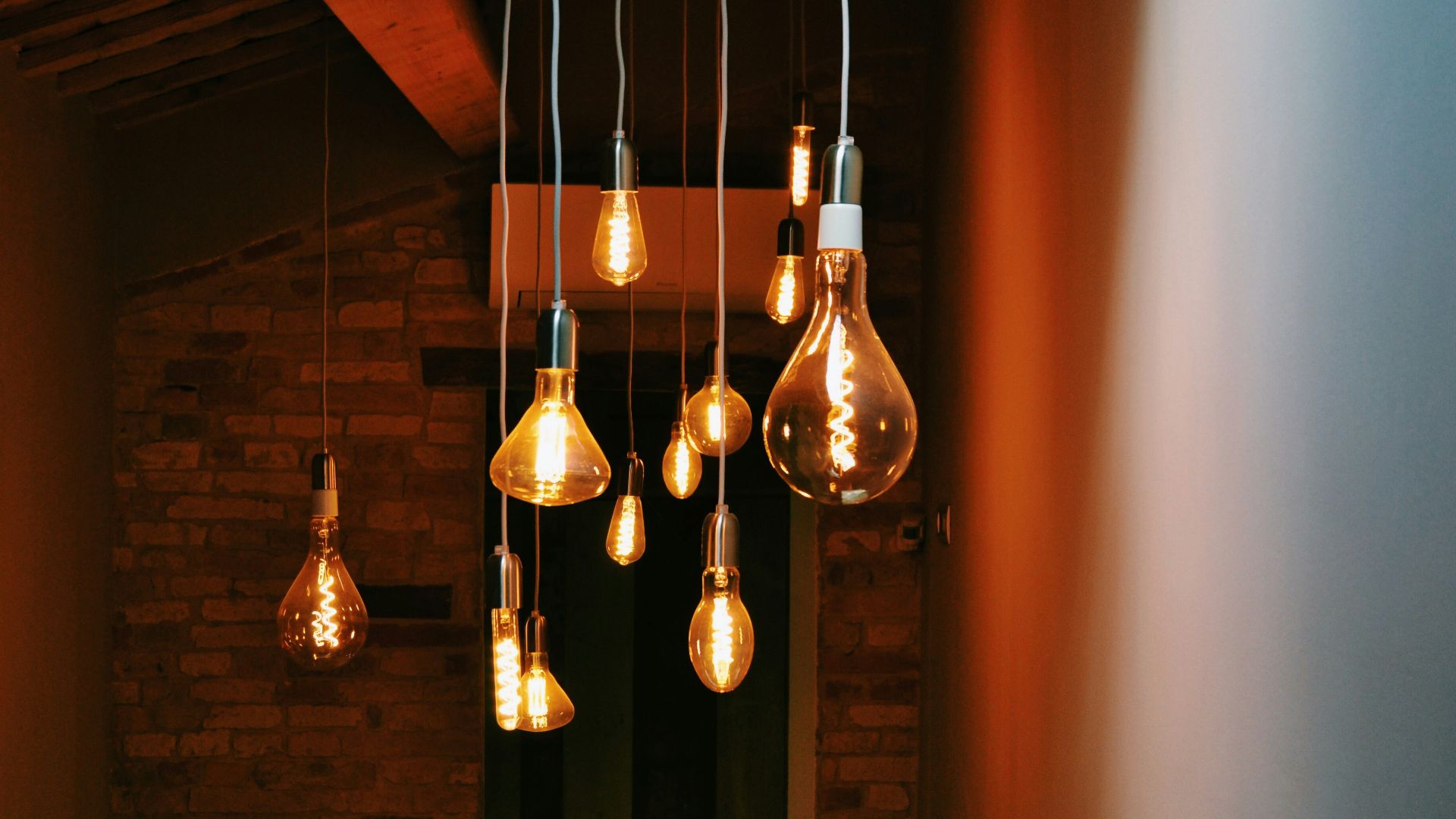 turned on orange pendant lamps