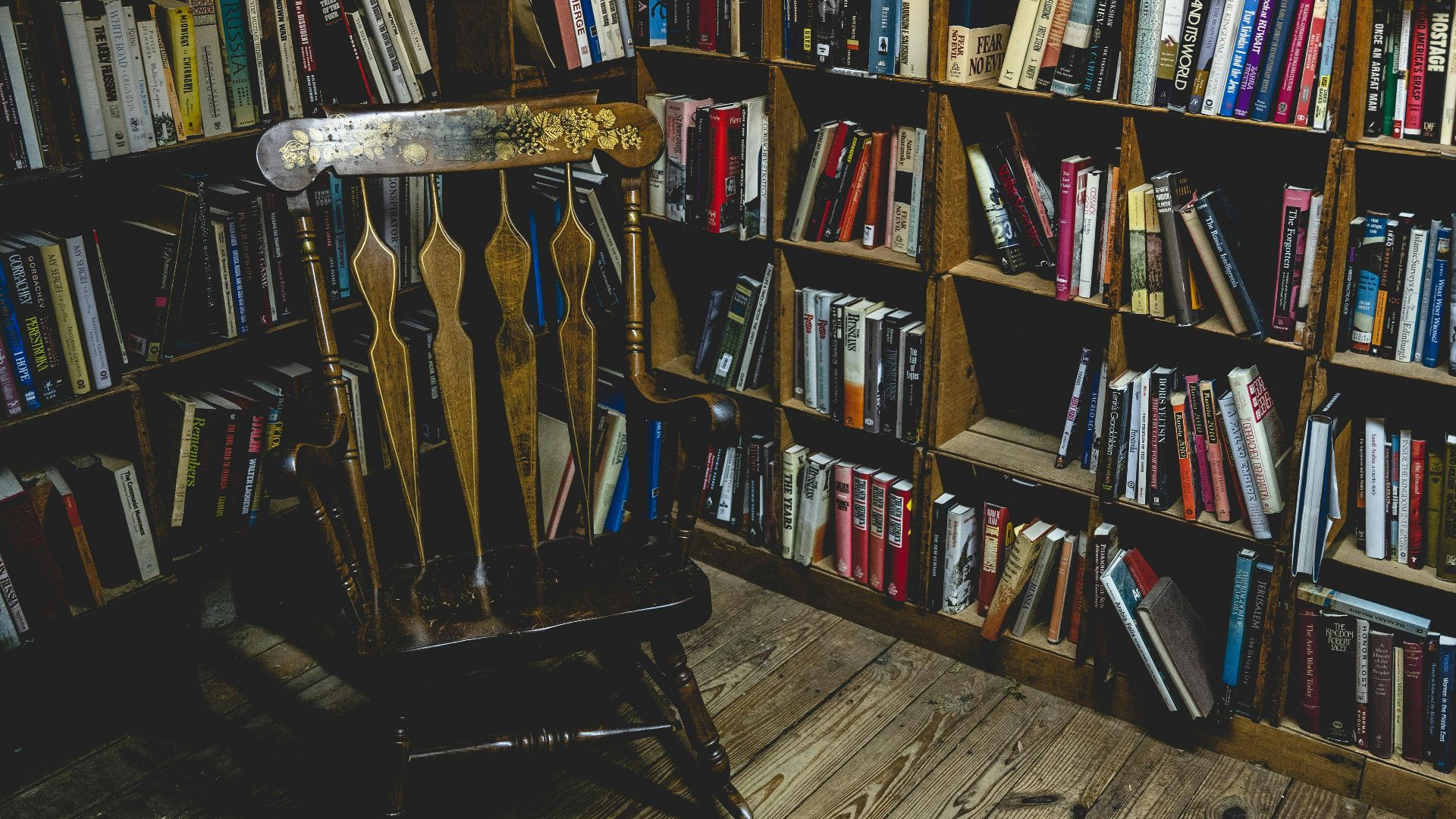 books on brown wooden shelf