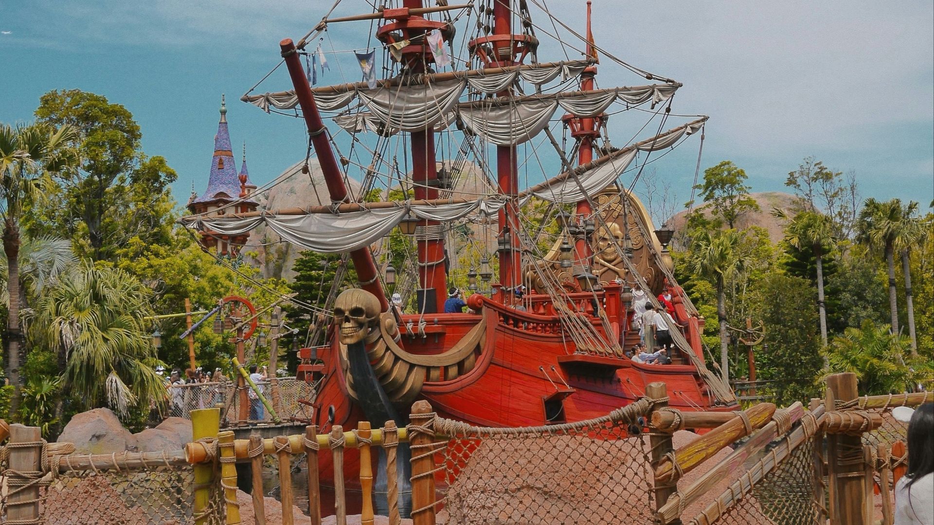 a red and white pirate ship on display in a park