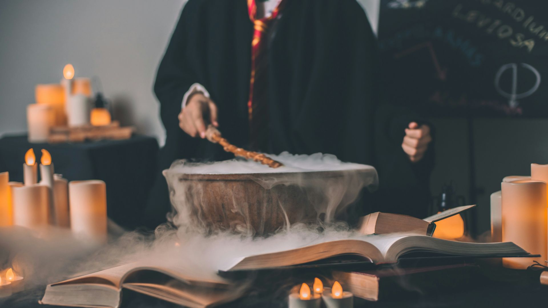 person holding wand on top of bowl
