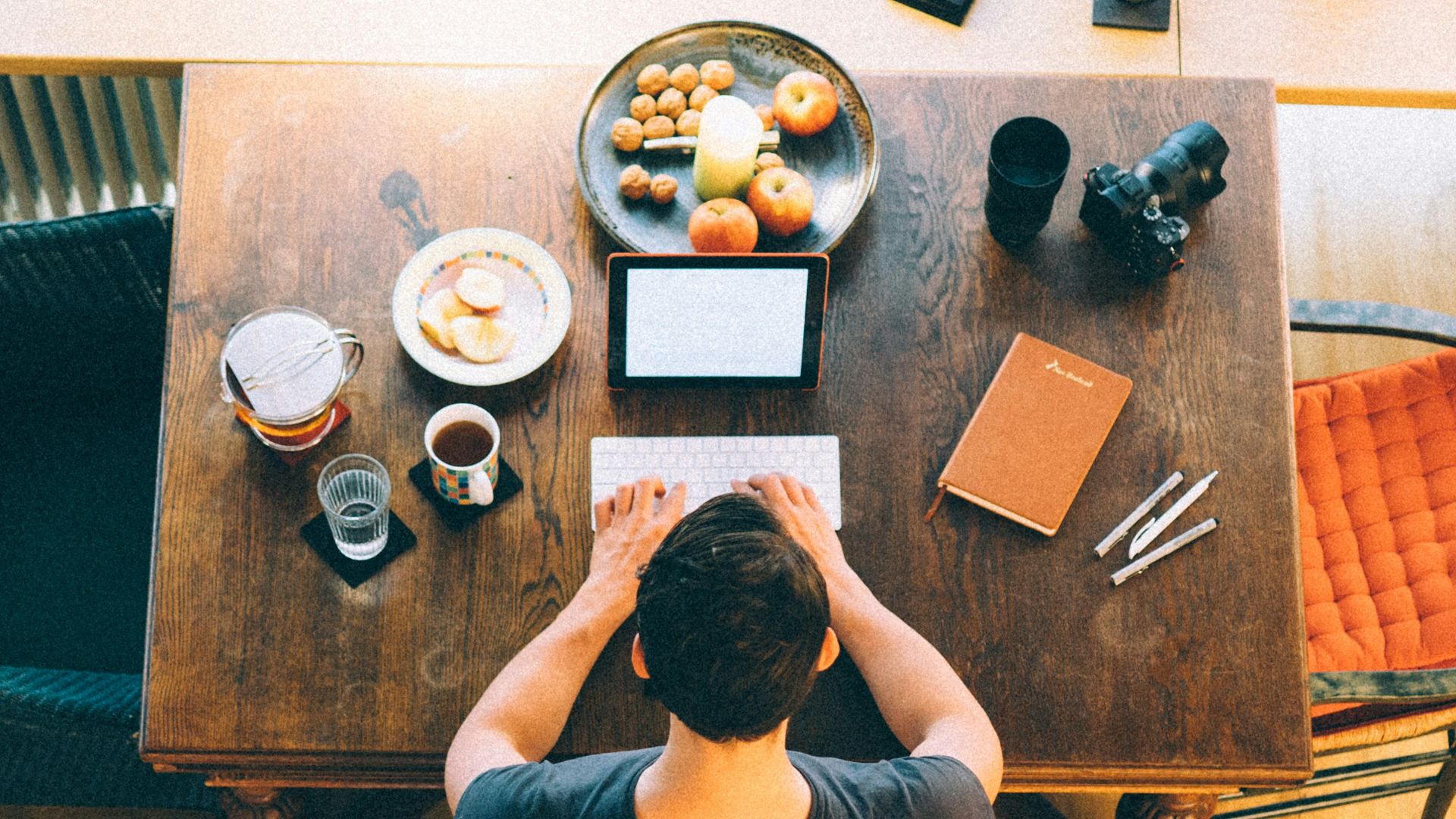 man typing on keyboard inside room