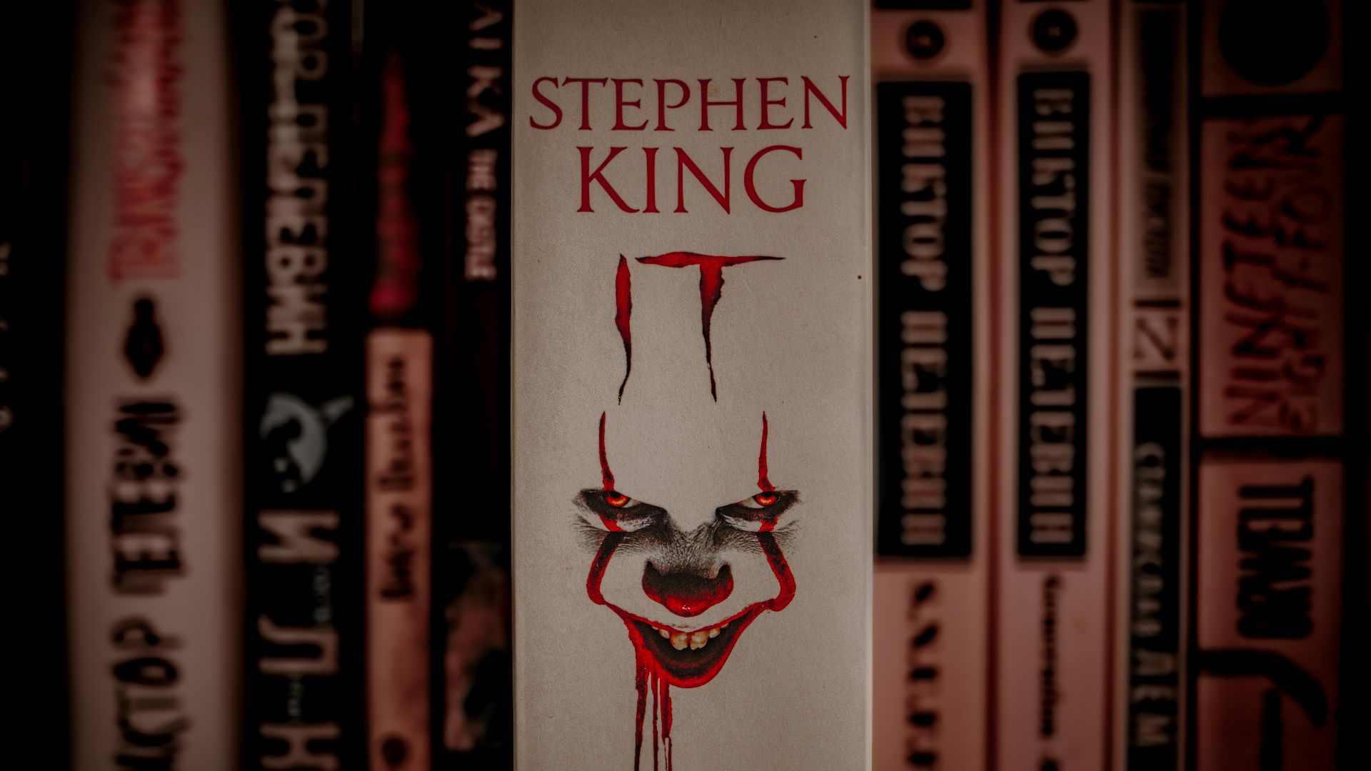 A book with a creepy clown face on it