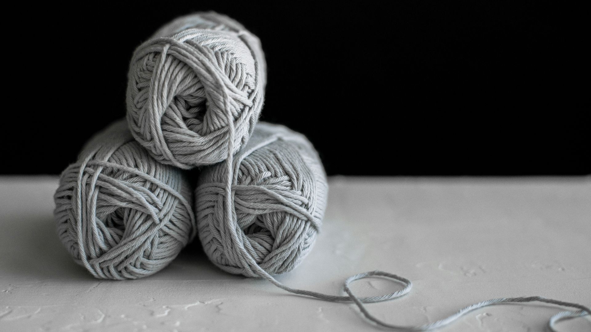 three yarns on table