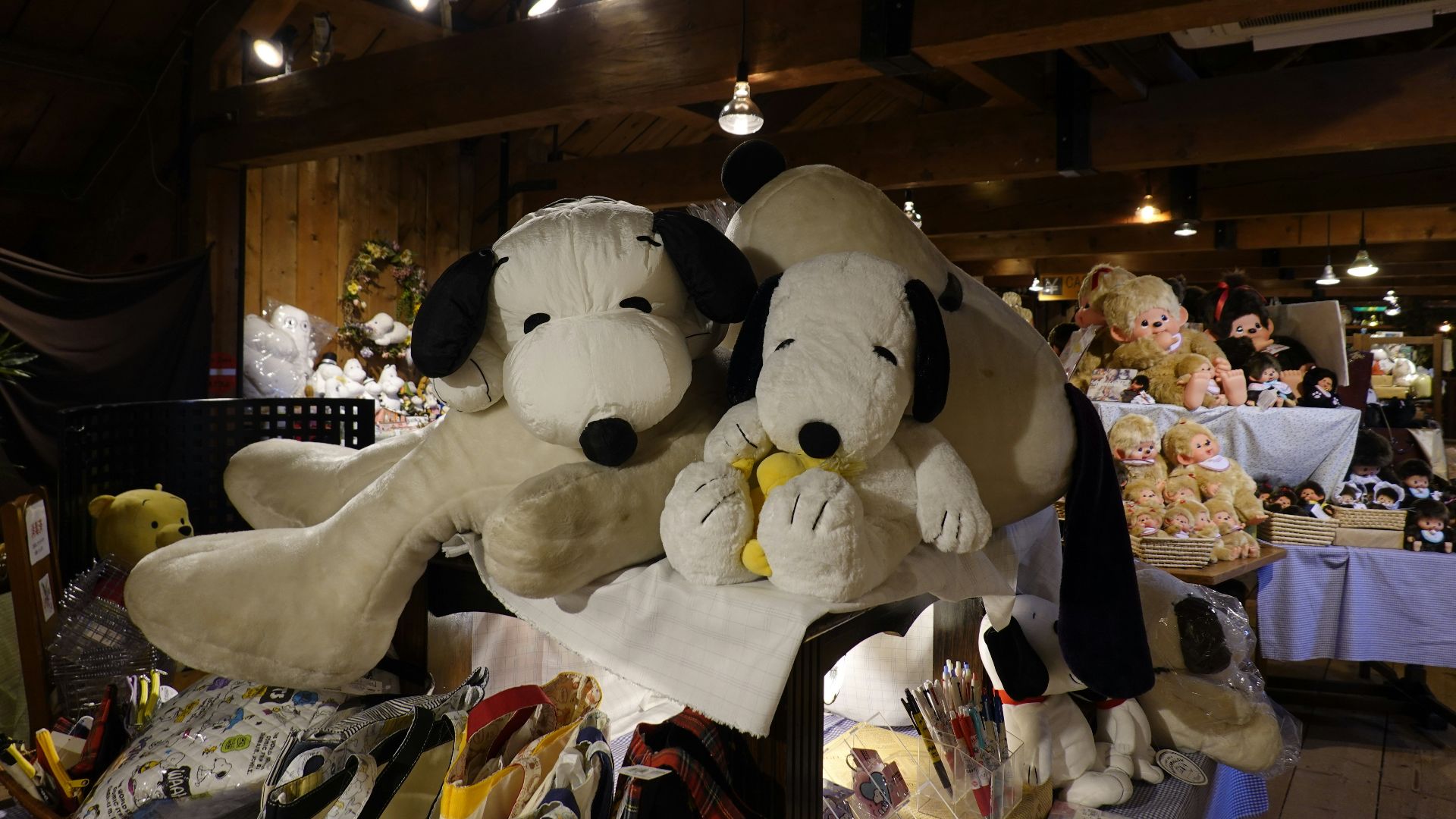 two stuffed dogs sitting on top of a table