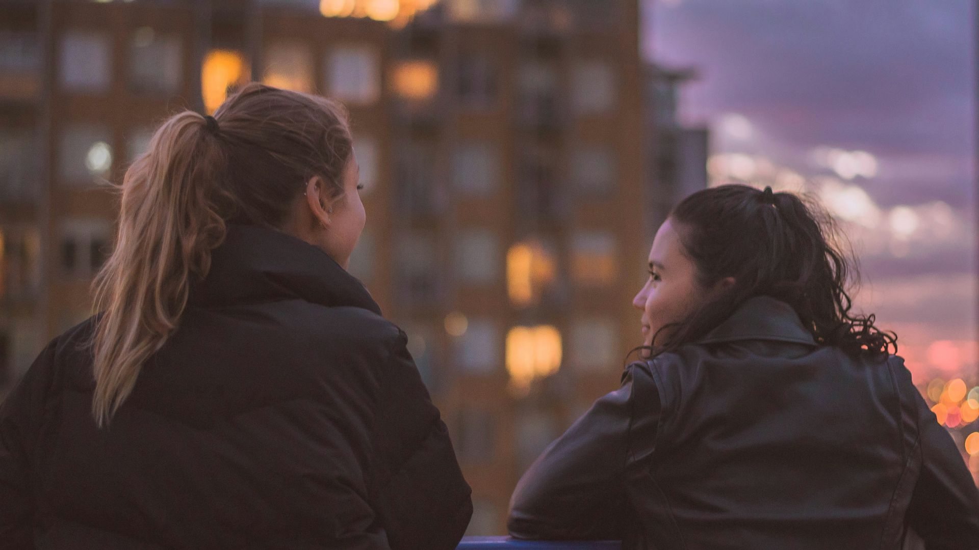 two women standing near railings