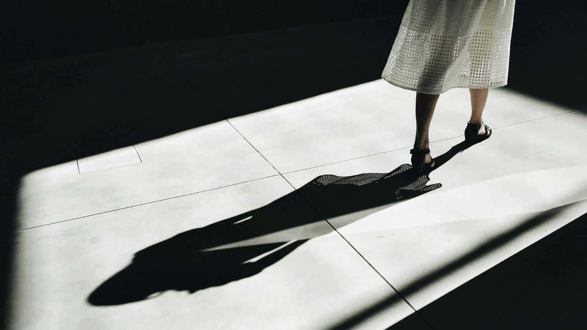 woman walking with shadow