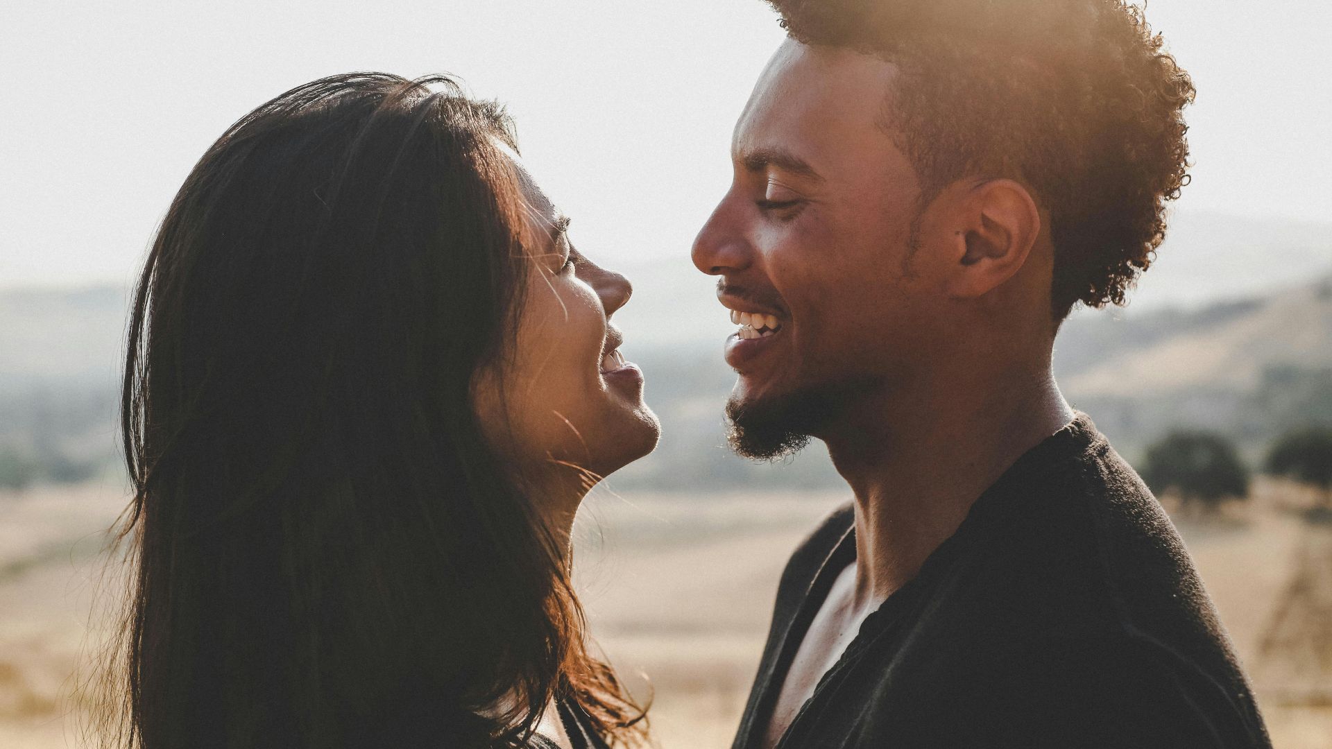 man and woman facing