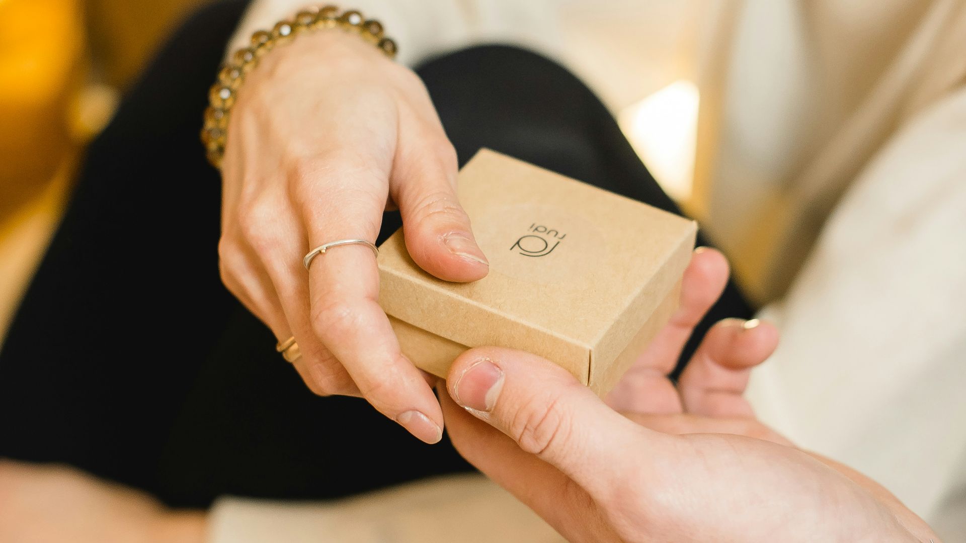 woman in white dress holding gold iphone 6