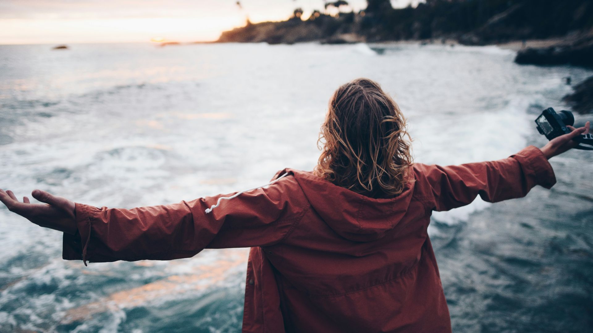 person standing near body of water