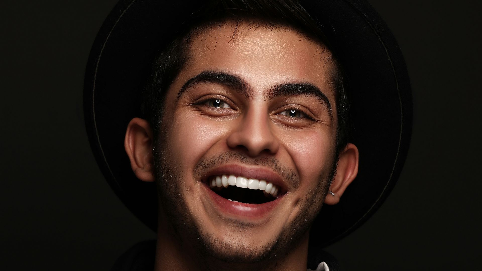 man in black and white nike zip up jacket smiling