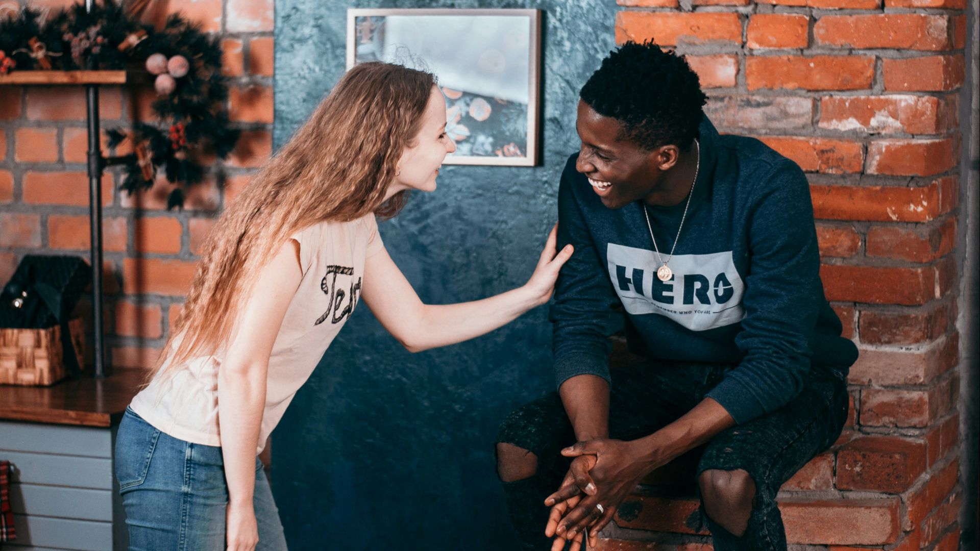 man and woman standing near wall