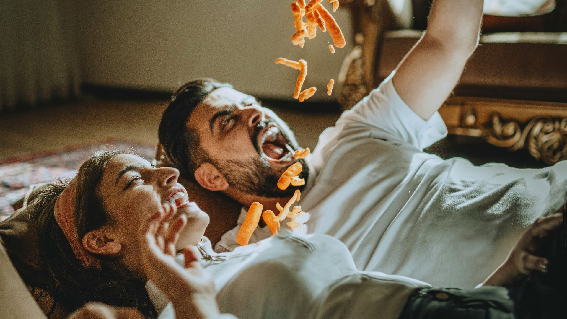 a man and a woman laying on the floor