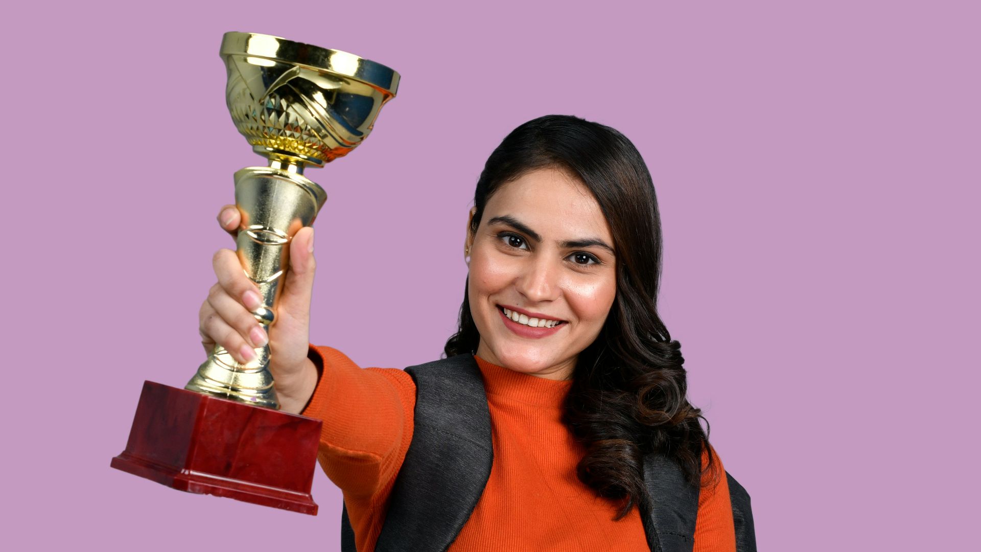 a person holding a trophy