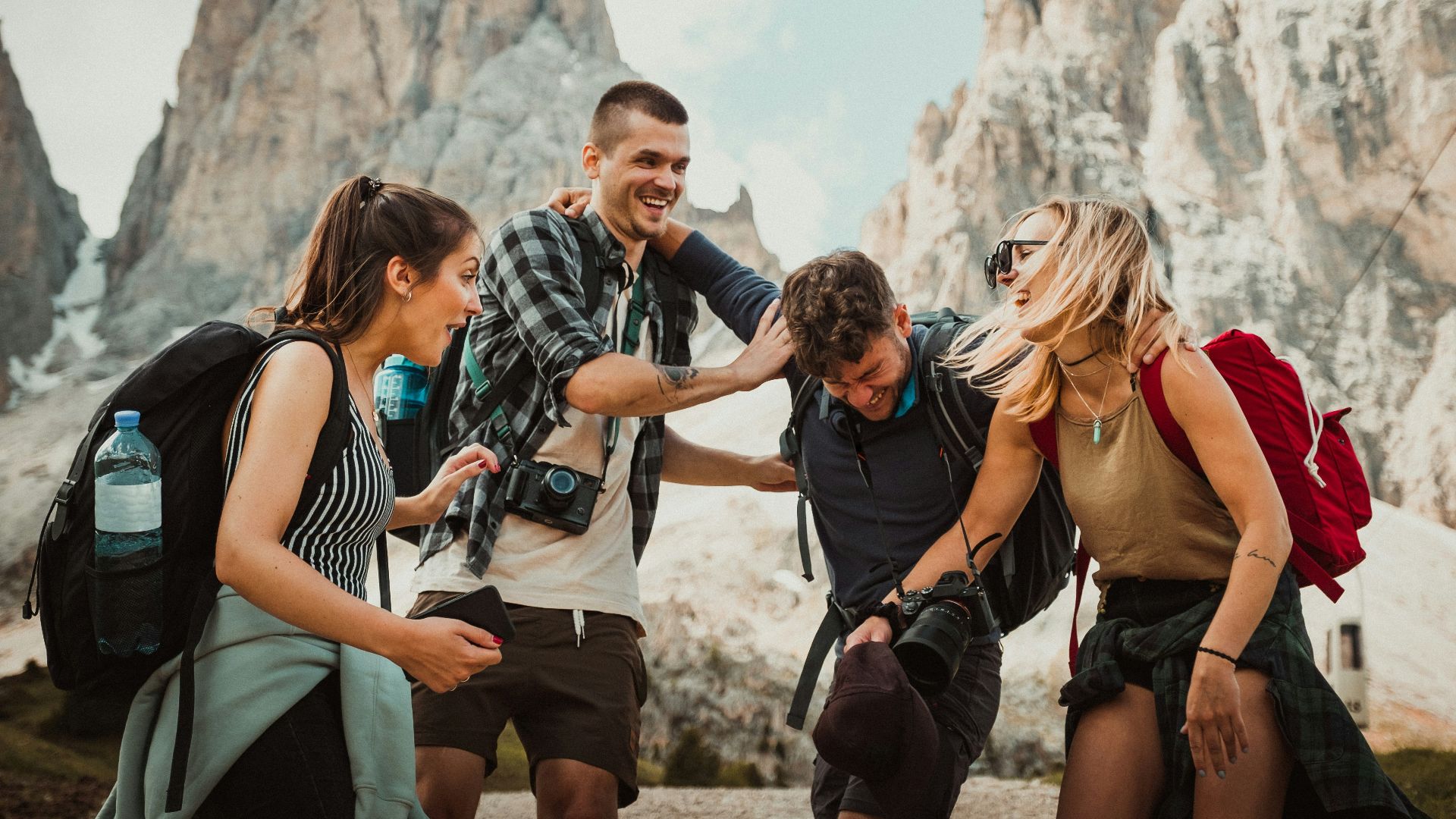 low-angle photography of two men playing beside two women
