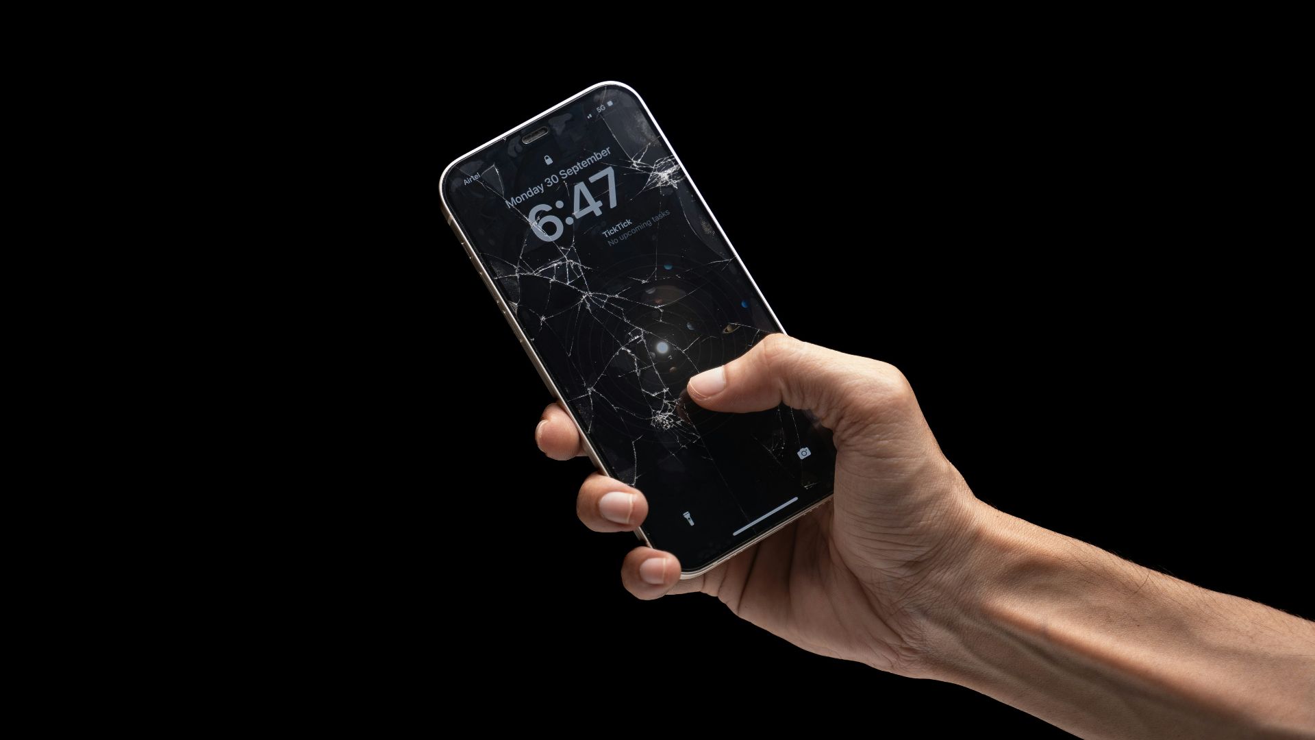 A person holding a cell phone in their hand