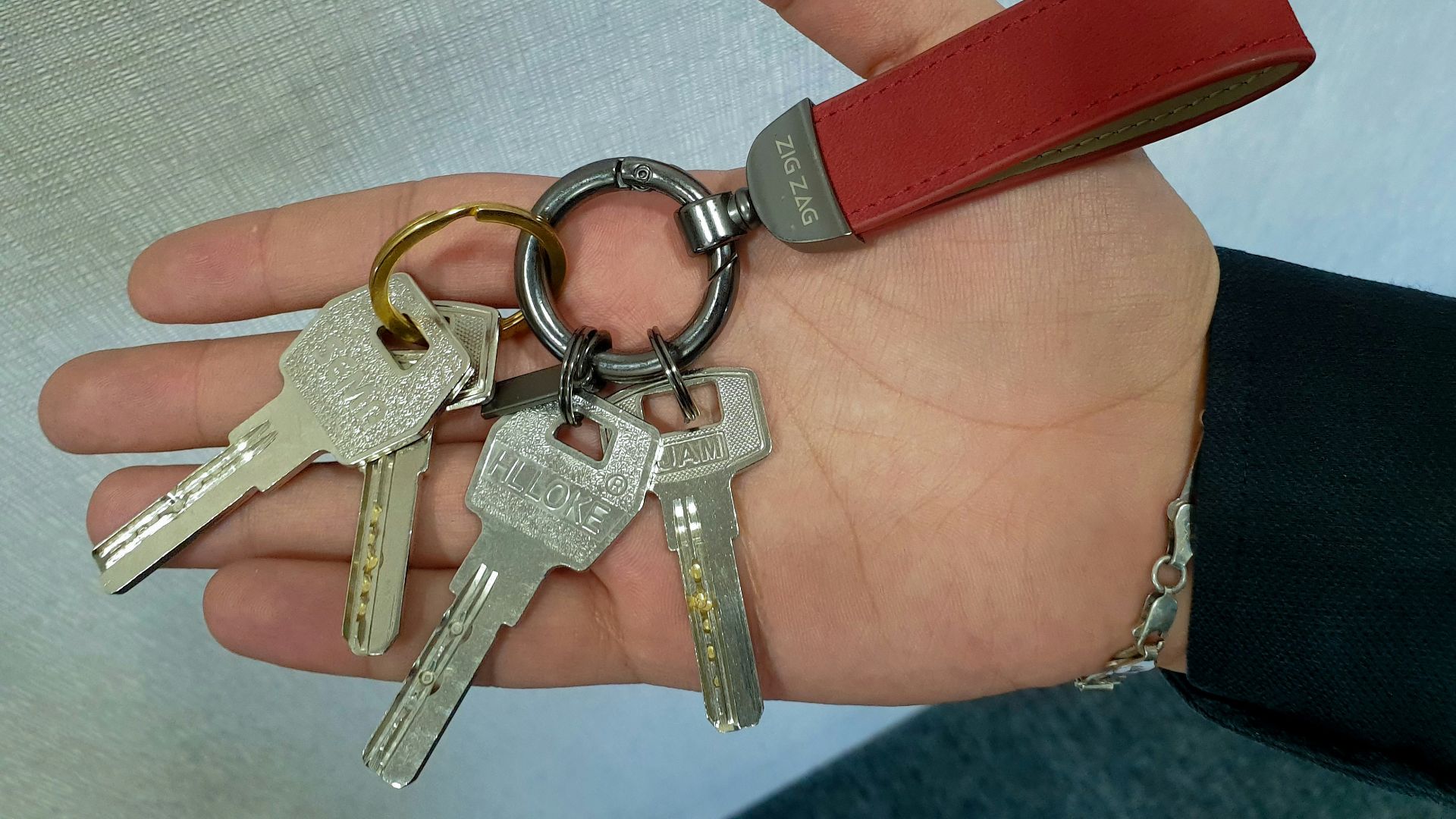 a person holding a bunch of keys in their hand