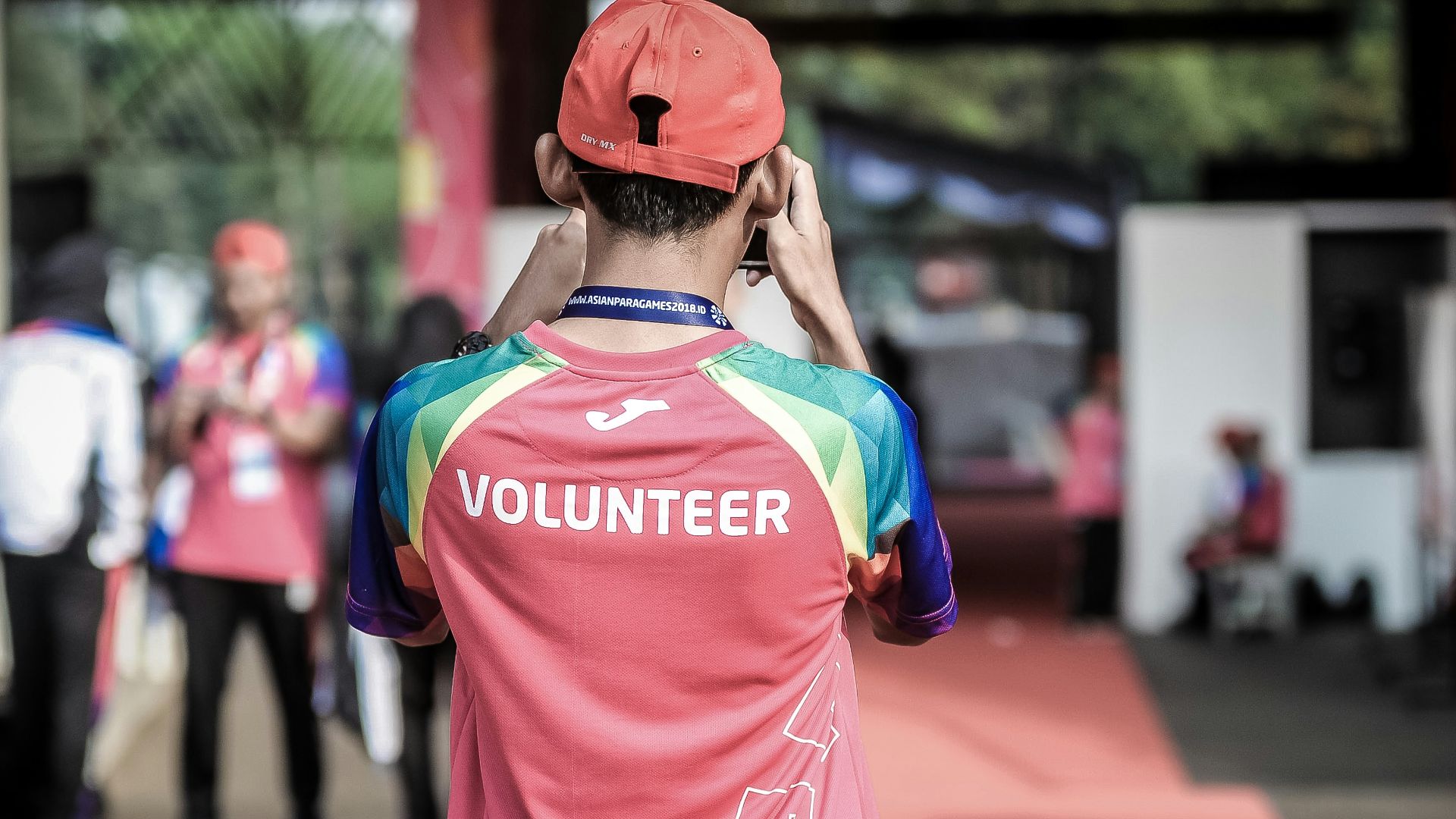 person standing wearing red shirt