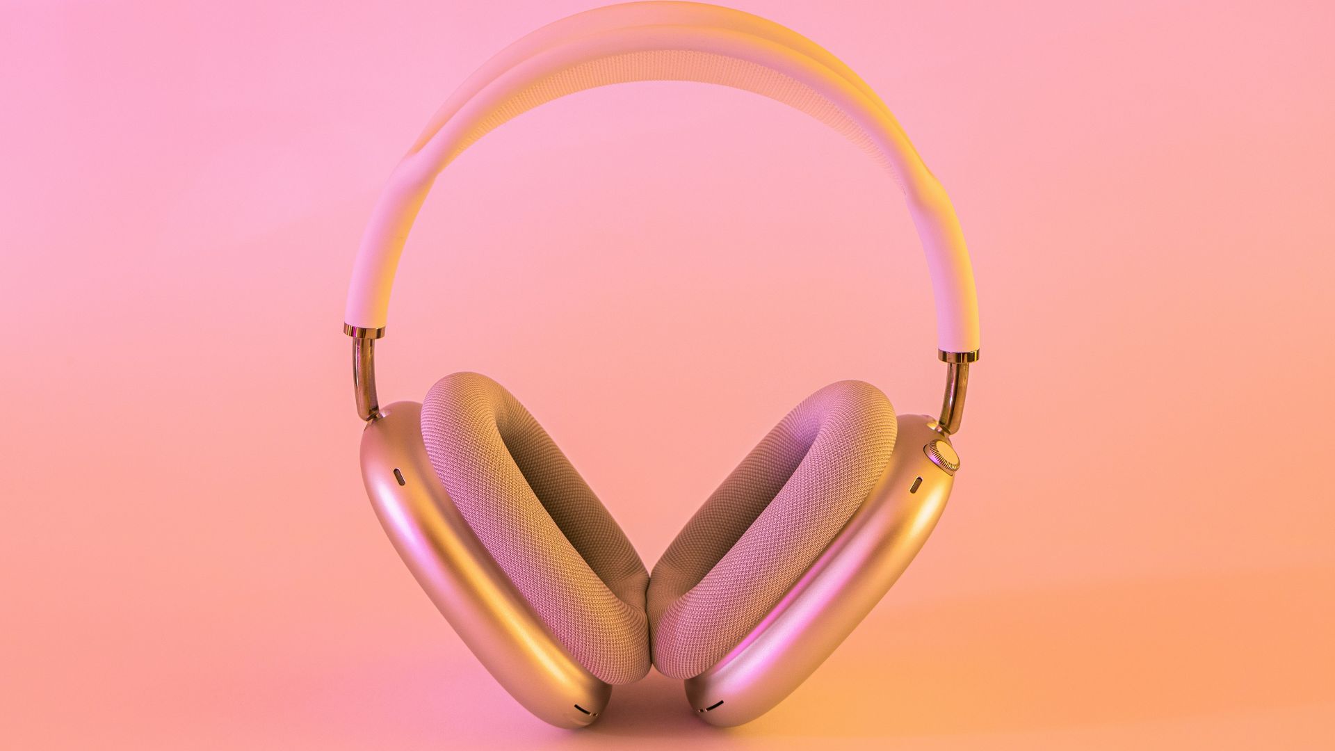 pink and white wireless headphones