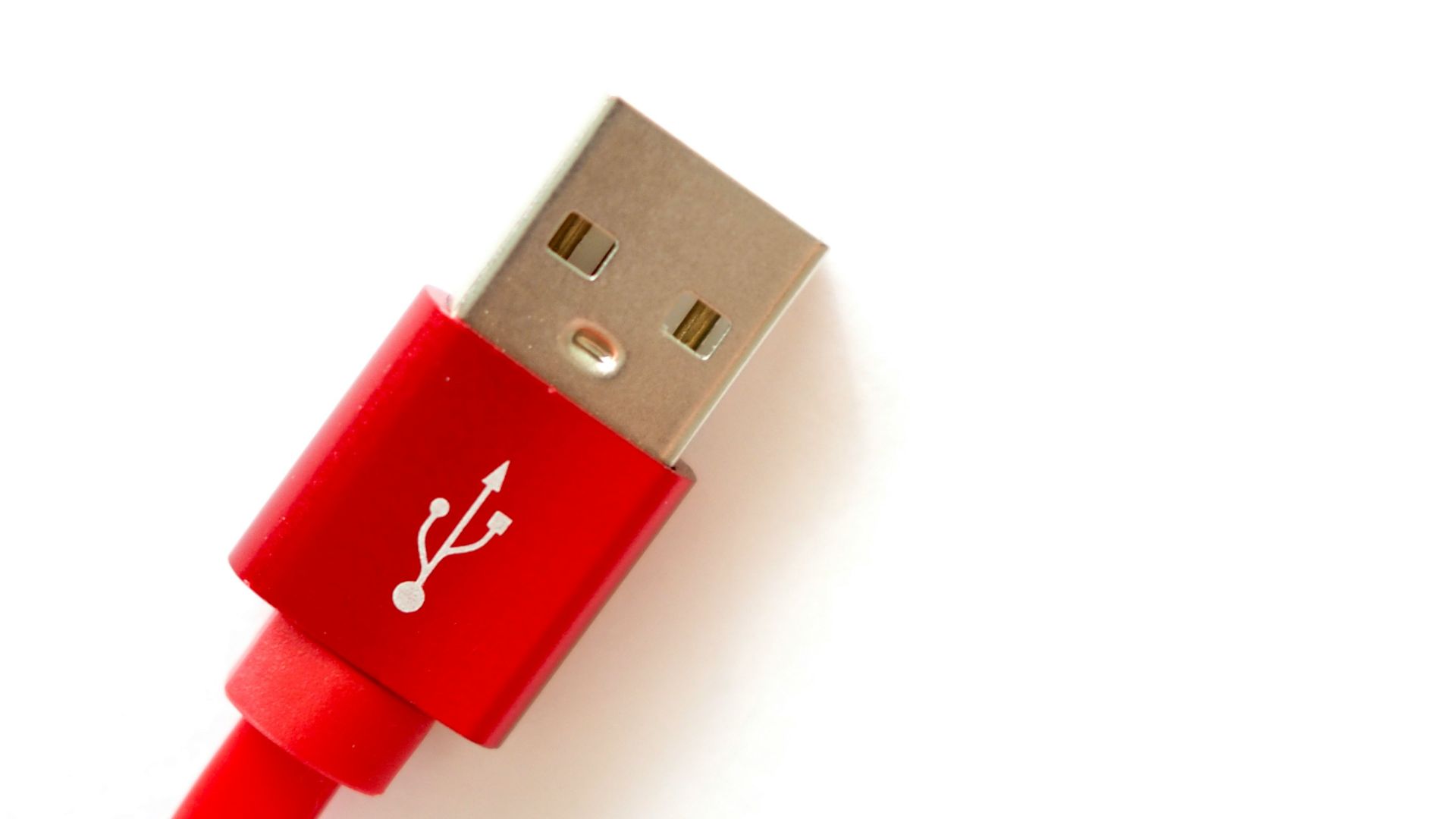 red usb cable on white surface